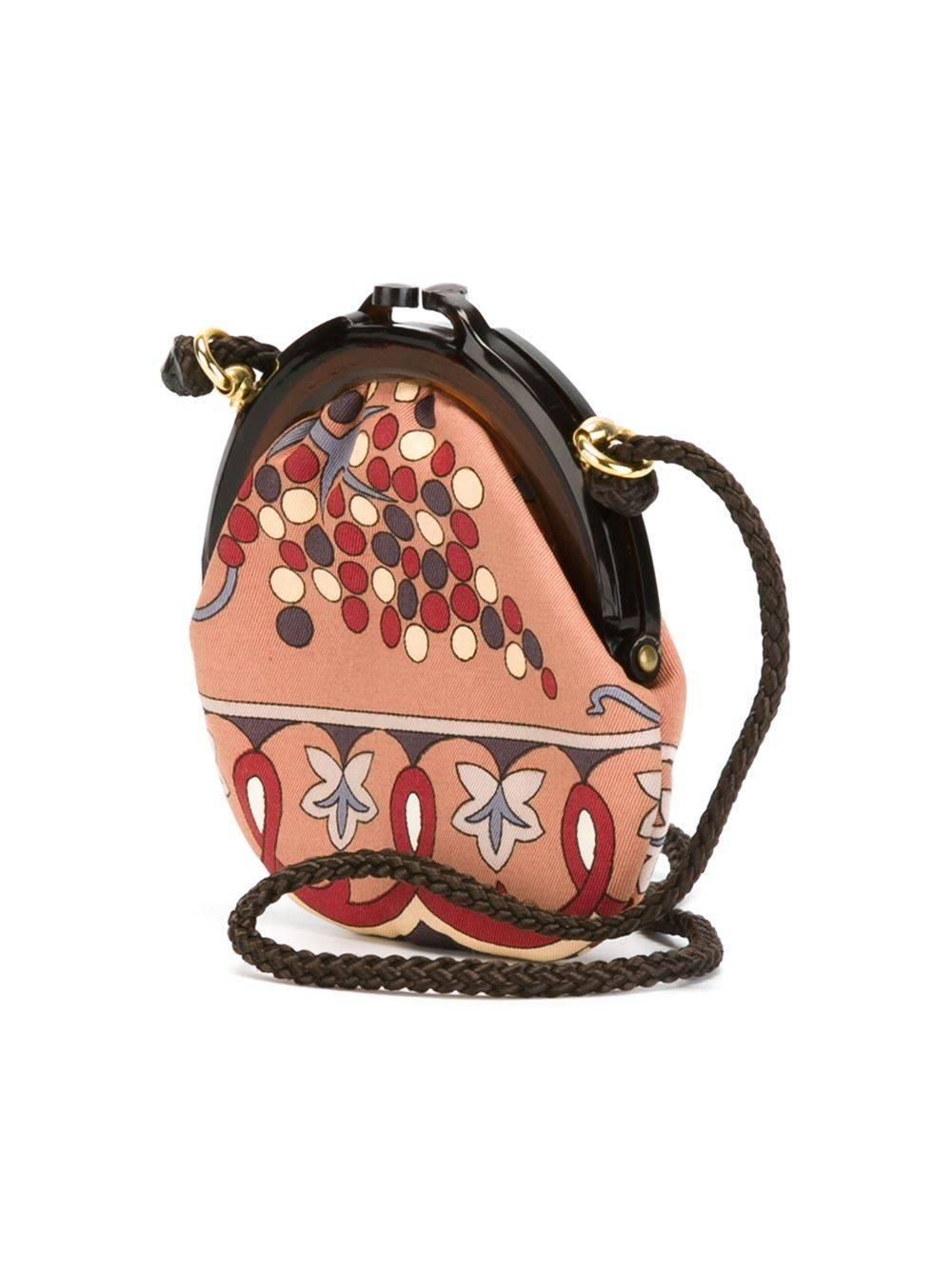 This small vintage pouch bag from Emilio Pucci is crafted in a retro print fabric and features a rope handle and a plastic frame with a kiss lock.

Colour: Multi
Material: Cotton 100%
Measurements: width: 11cm, height: 11cm, depth:
