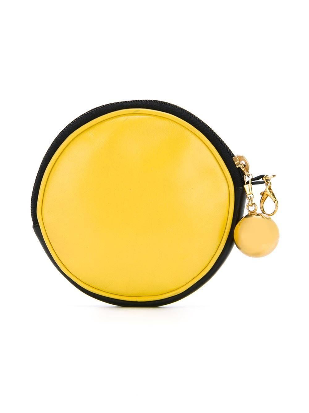 This vintage pouch from Moschino features a smiley face design on the face, a leather body, cotton interior, gold-tone hardware and an orb-detailed zip.

Colour: Yellow

Material: Leather

Measurements: width: 13cm, height: 13cm, depth:
