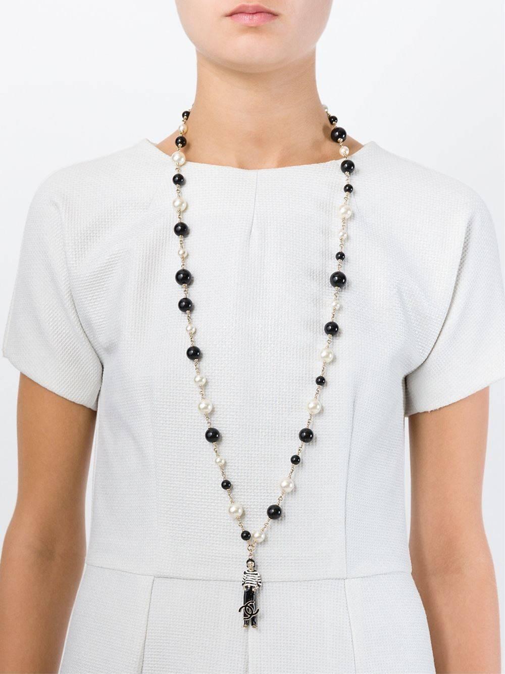 Black and white Coco Chanel pendant necklace featuring a lobster claw fastening and multiple glass beads and faux pearls. 

Colour: Black, White

Material: Glass 40% Plastic 10% Metal (Other) 50%

Measurements: L: 46cm Pendant L: 5cm Pendant