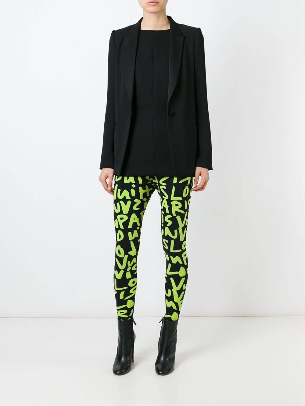 Black and green Stephen Sprouse graffiti leggings. 

Colour: Black and Green

Material: Polyamide 80% Spandex / Elastane 20%

Measurements: Waist: 70cm, Hips: 100cm, Front rise: 29cm, Back rise: 30cm, Inside leg: 63cm, Hem width: