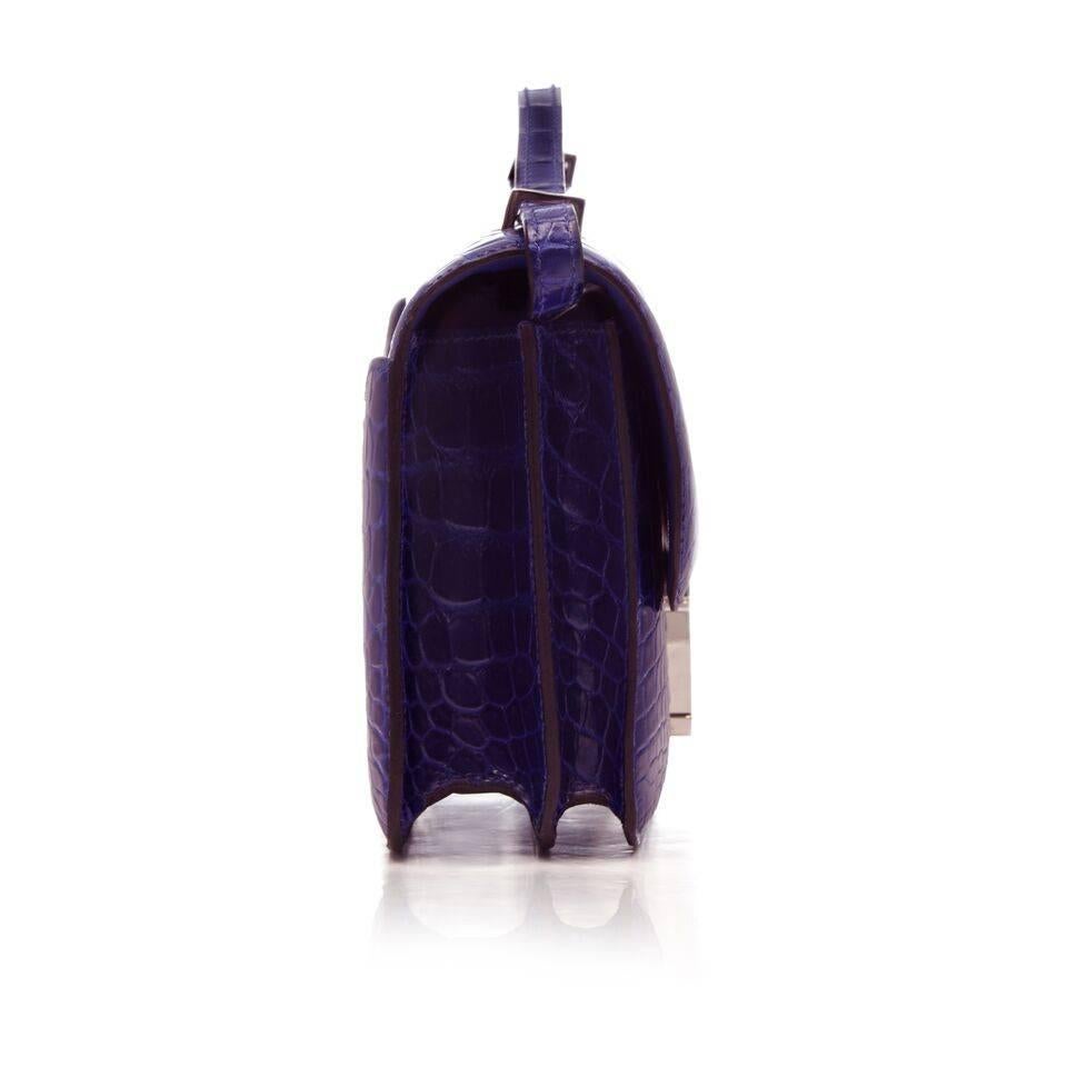 The desirable blue Alligator clutch wallet from Hermes exudes classic style with a pop of colour. The beautifully crafted crocodile niloticus lisse leather features a strap, palladium hardware and two spacious internal compartments with pockets in