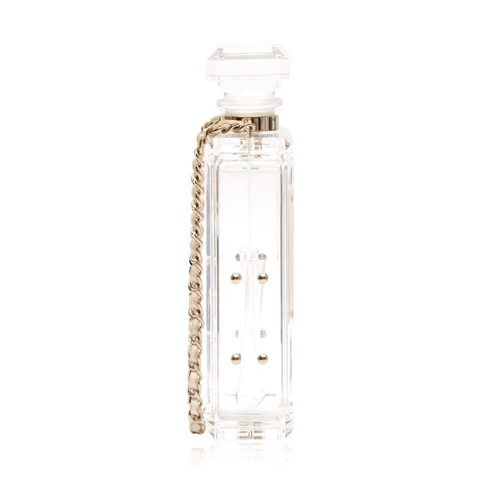 This rare collectible item exudes the essence of the classic and elegant Chanel brand. The glass design features Chanel's classic chain strap and gold-plated hardware.

The item comes with:

Chanel Box
Chanel Dust-Bag
Material Care