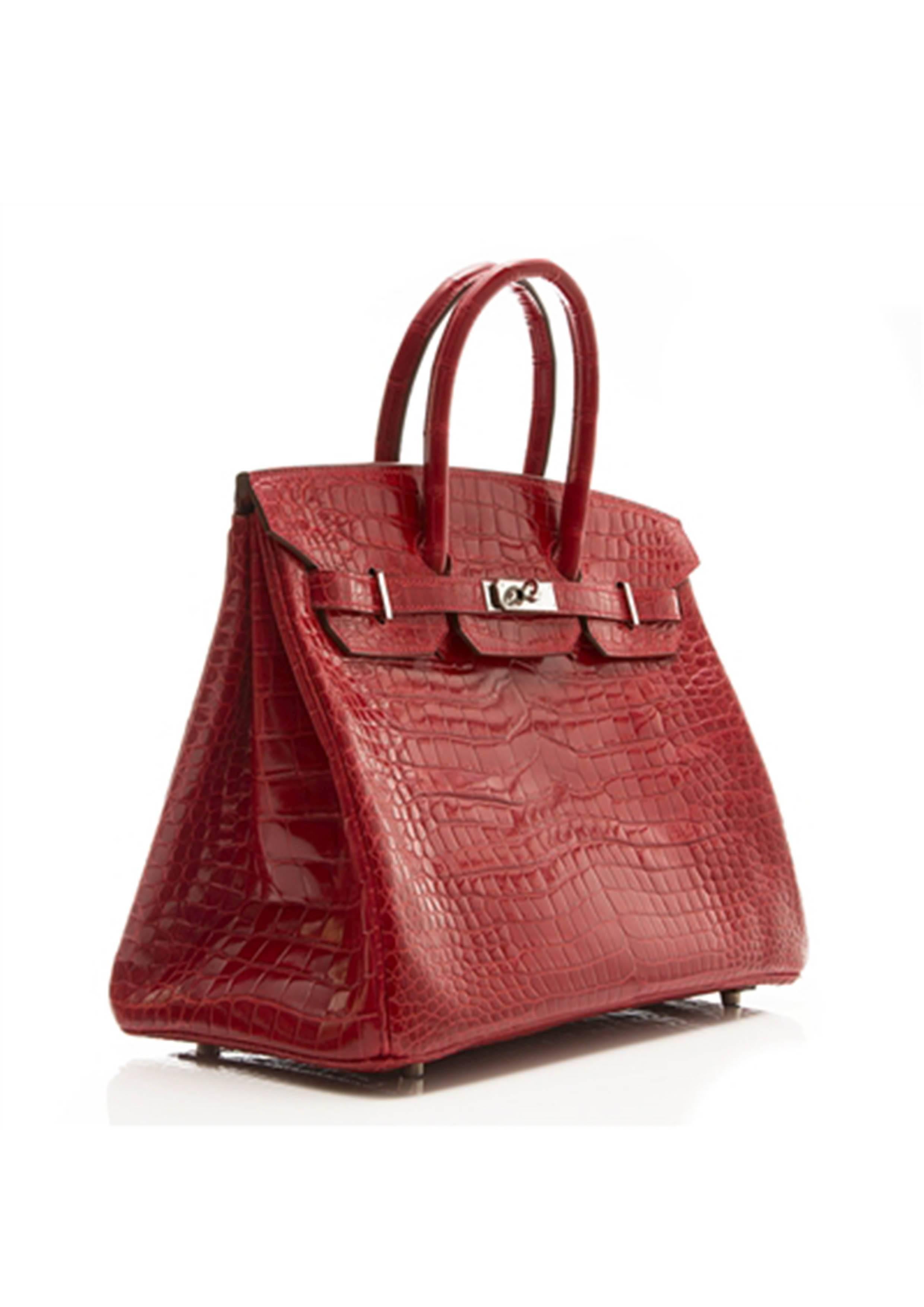 This truly exquisite piece represents the incredible craftsmanship one has come to expect from Hermés' Birkin bag range. The 35cm size is perfectly complemented by the bold Rouge Braise colour of the Porosus crocodile leather and palladuim