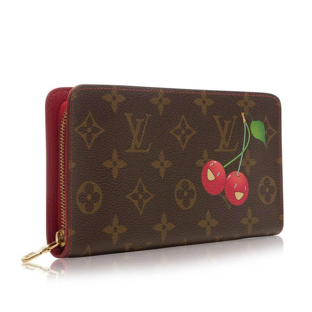 This Louis Vuitton piece is from the desired collection collaborated with contemporary artist Takashi Murakami. The beautifully designed wallet features gold-plated hardware, two spacious compartments and an internal zip-compartment.

Colour: