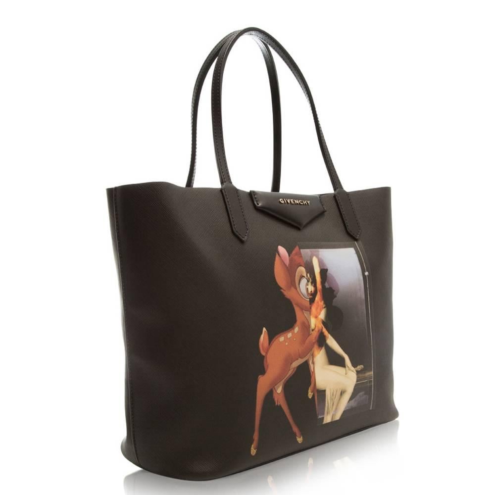 This Bambi tote is a very sought after piece for its contrasted image. The desired Givenchy tote features palladium hardware and pouch.

This item comes with:

Pouch with same Bambi design as tote
Material Care Guide
Colour: Black