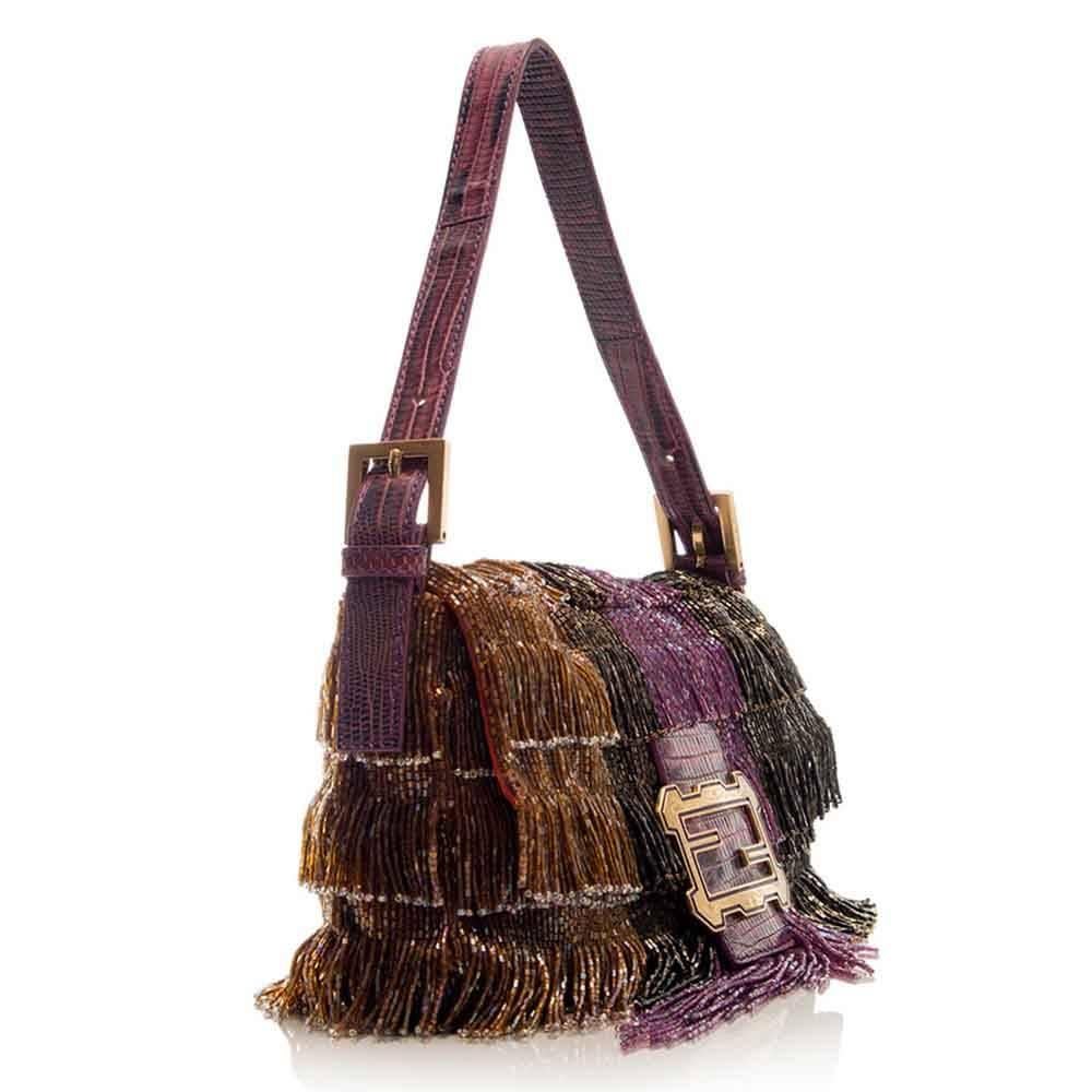 This daring beaded fringe bag is fun and can be worn as a statement piece. The intricately designed Fendi bag features gold-plated hardware, a spacious compartment and an internal zip-pocket.

Colour: Multi-coloured 

Material: Beads & Lizard