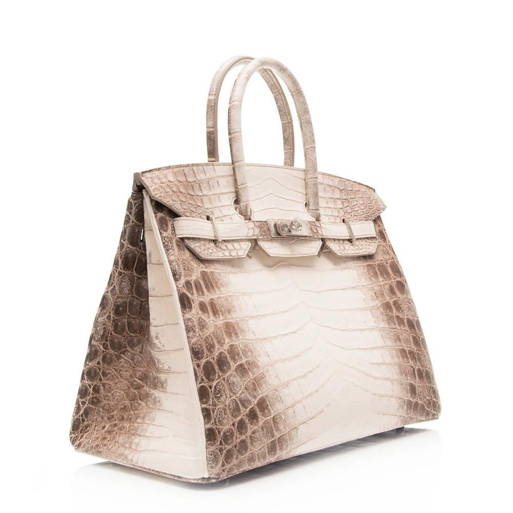 Brand new Hermès Himalayan matte Nilo crocodile 35cm Birkin bag featuring Palladium hardware. This bag is This bag is in perfect condition and still has the plastic on the hardware. 

Colour: 'Himalayan'

Material: Crocodile