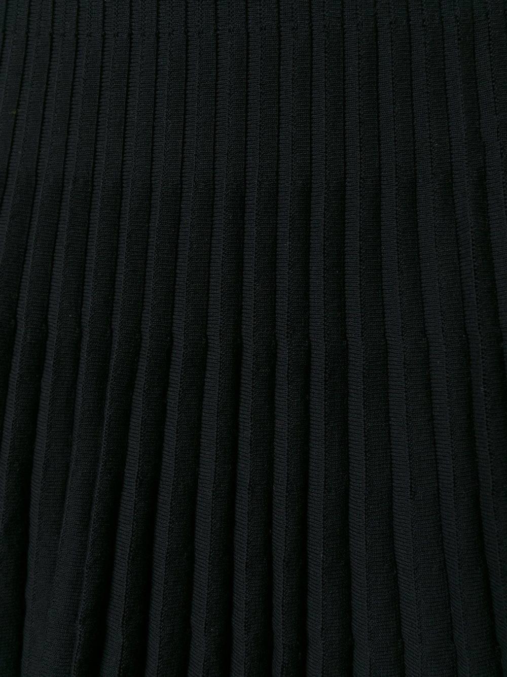 Christian Dior black stretch cotton blend ribbed A-line skirt.

Colour: Black

Size: FR 38

Materials: Spandex/Elastane 10% / Polyamide 13% / Viscose 90% / Cotton 87%

Measurements: hips: 90 centimetres, length: 60 centimetres, waist: 64