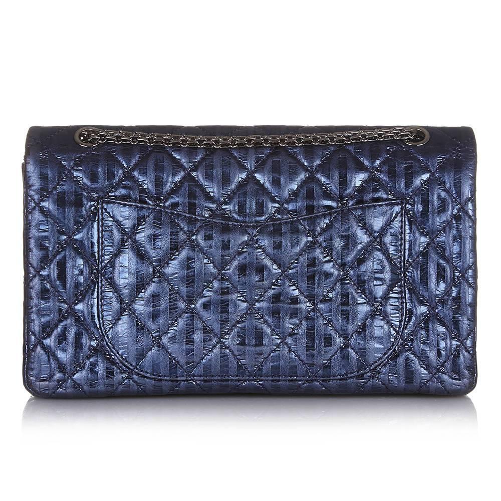 There are few Chanel leather finishes as coveted as the maison’s metallic calfskin. Crafted in a dazzling, navy metallic calfskin, this large Chanel Reissue 2.55 bag is finished with dark silver-toned hardware for a modern appeal. The leather is
