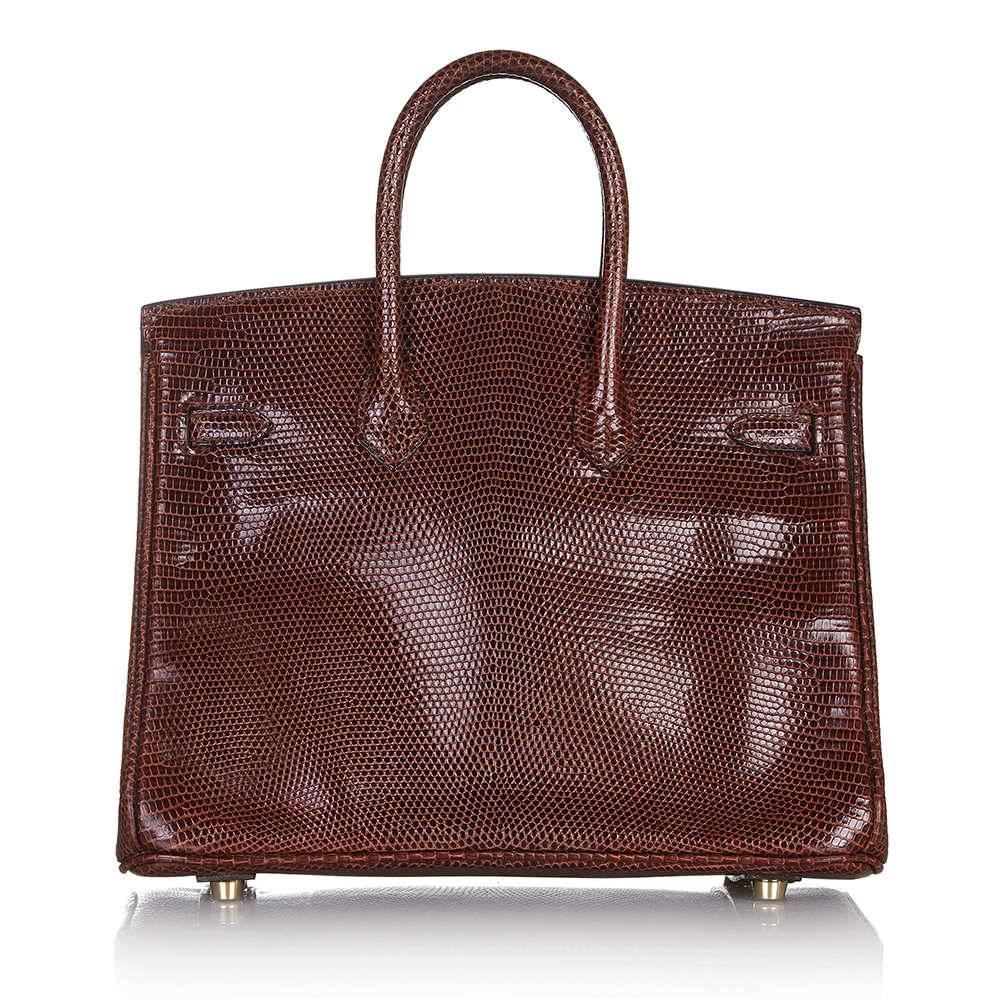 A spectacular edition of the Hermès Birkin handbag. Crafted in lizard skin, which is not usually found on larger leather goods given the rarity and small size of the reptiles. Its textured, Cocaon-coloured exterior is classically offset with