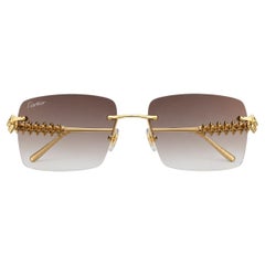 Gafas de sol Cartier Clash sin montura, de oro y con lentes grises, unisex
