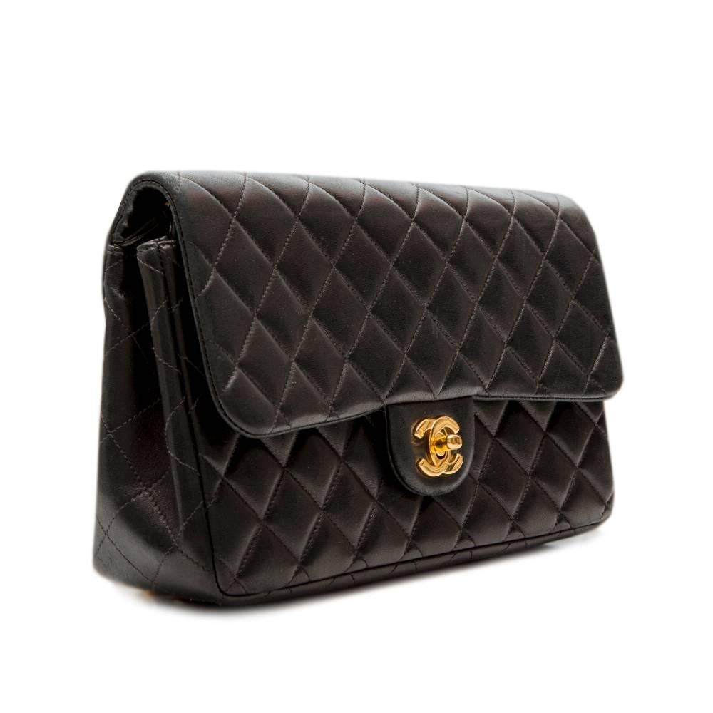 This backpack is a fun and practical adaptation of the classic, well-loved Chanel 2.55 bag. Ideal for travelling, this effortless bag is expertly crafted from quilted black lambskin and features gold-tone hardware. This is complemented by a foldover