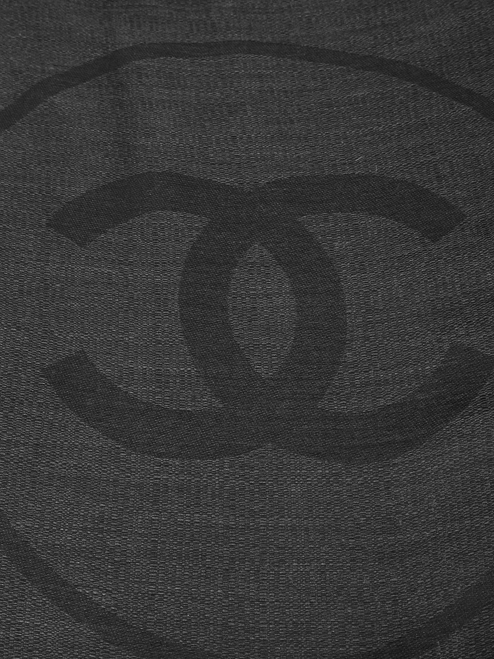 Elegant in its simplicity, this Chanel scarf is spun from a silk-cashmere blend. Featuring a translucent silk border, framing a black panel embossed with the Chanel monogram.

Colour: Black

Material: 70% Silk, 30% cashmere

Measurements: Length: