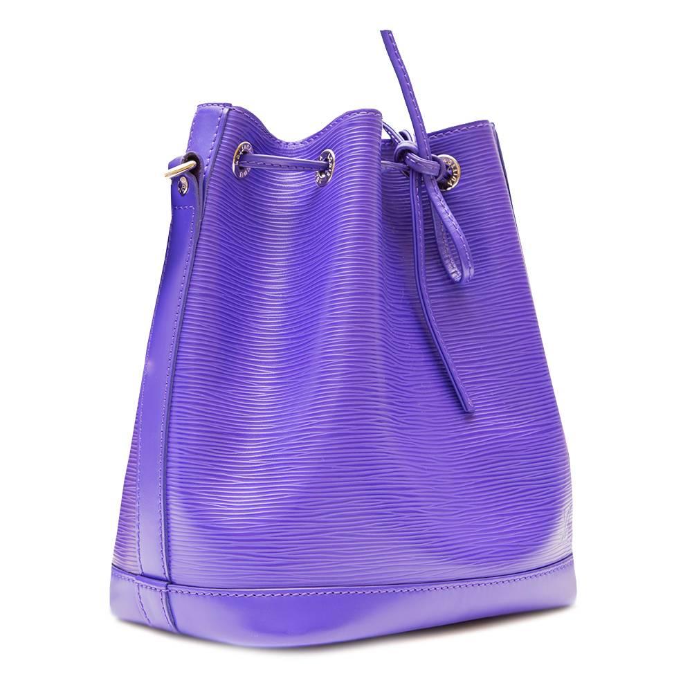 Beautifully vibrant and eye-catching, this Louis Vuitton purple Petit Noe bag in Epi leather is perfect for everyday essentials and will add a fun pop of colour to your outfit. Complemented by a coordinating purple suede interior, the bag is stamped