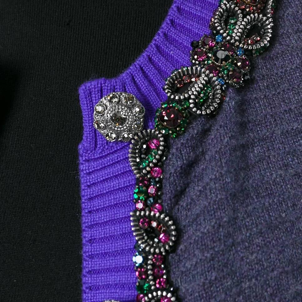Chanel is renowned for elevating knitwear, and this vintage cardigan stands to prove it. A ribbed violet cardigan is generously embellished with glimmering crystal trims. Its crystal-encrusted buttons are also embossed with Chanel logos.

Size: 40