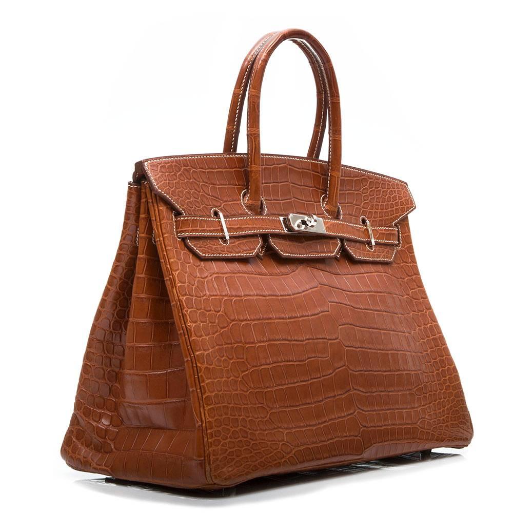 There are few handbags quite as timeless as an Hermès Birkin in a neutral colourway. This edition is crafted from a Fauve brown Porosus crocodile leather with a matte finish and palladium hardware. Among the most precious of the exotic skins, the