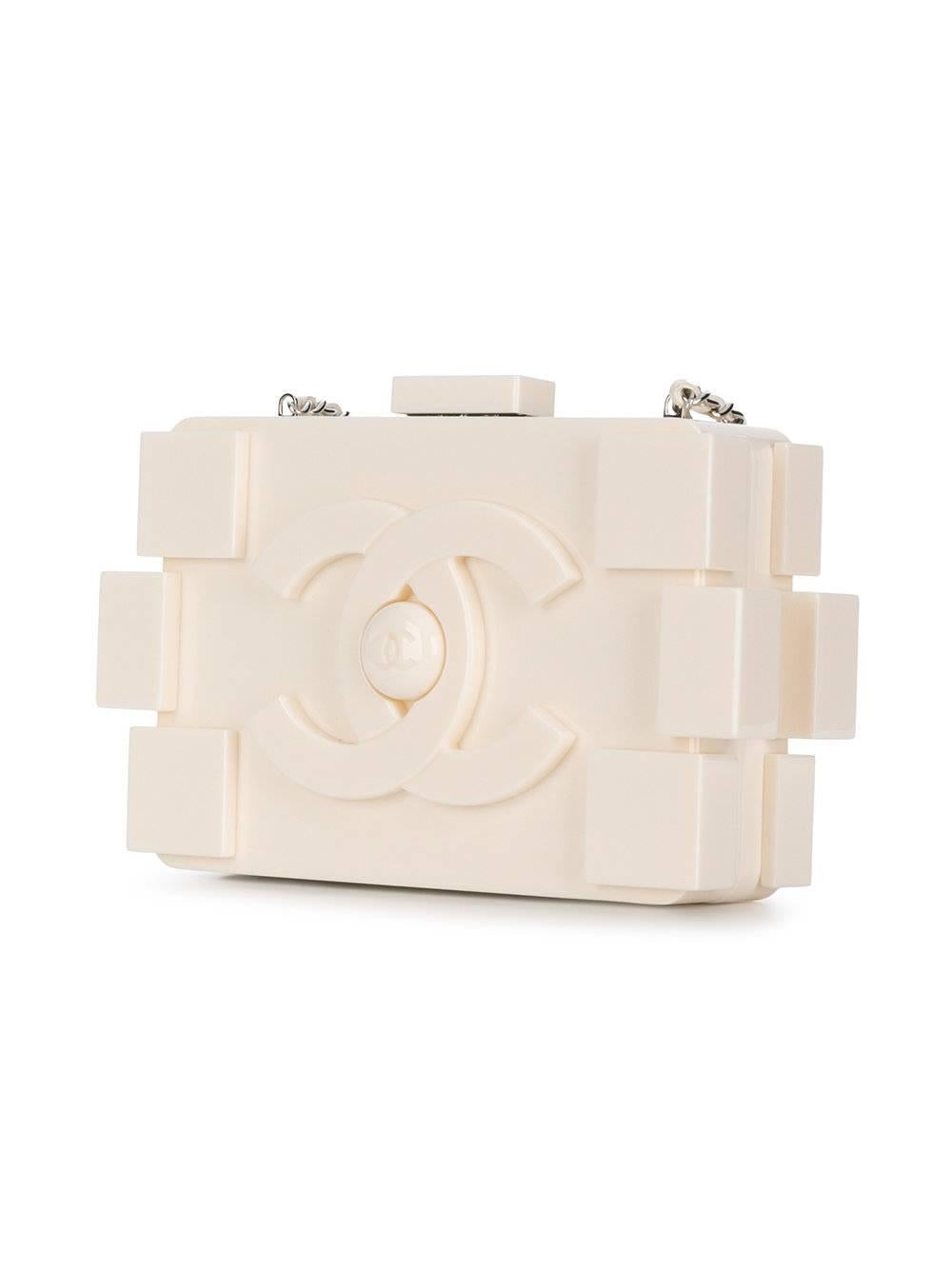 This Chanel Lego Brick Bag is super modern, yet elegant in its off-white tone. The bag features an internal zipped pocket, a top clasp fastening, a chain shoulder strap and is set off by its silver-tone hardware.

Please revert to images for