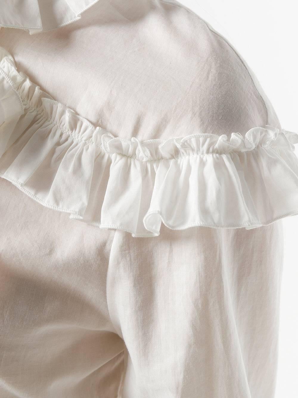 With a Victorian vibe, this ivory cotton-silk shirt is adorned with frayed ruffles and Gucci's signature pussy bow collar. The shirt features a front button fastening and the sleeves are cut wide and 3/4 length for versatility.

Colour: