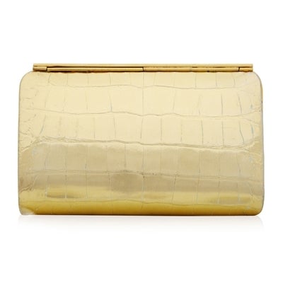 Finished to glimmering perfection, this vintage Lana Marks handbag is truly enchanting in its sleek, burnished gold crocodile-effect leather. Its snap-lock fastening opens to reveal a beautiful beige-lined leather, fitted with two open pockets.