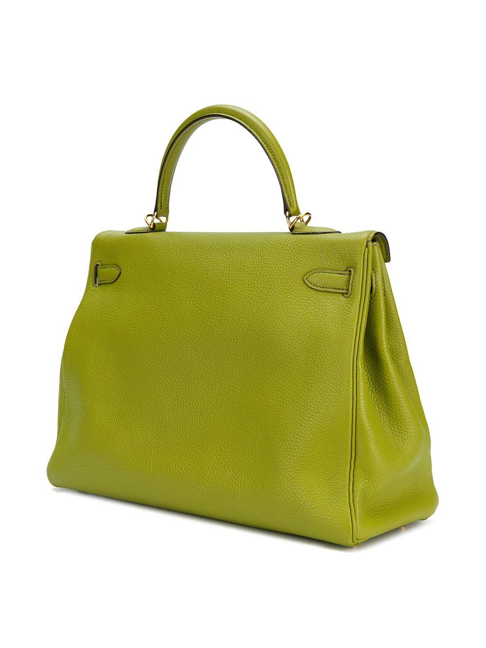 Treat yourself to this exotic Vert Anis Hermès Kelly bag, a true testament to the quality of the house's craftsmanship, exuding timeless style and elegance, perfect for any occasion. Rendered in a smooth and lightweight Togo leather, popular for its