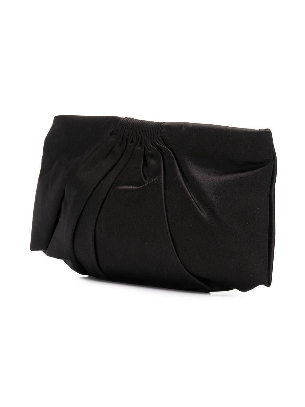 Make a classic statement for cocktail hour with this black satin Chanel clutch featuring a pleated silhouette, ribbed detailing and a top-zip fastening offset by a logo charm and accented by silver-plated metal hardware. The clutch’s main