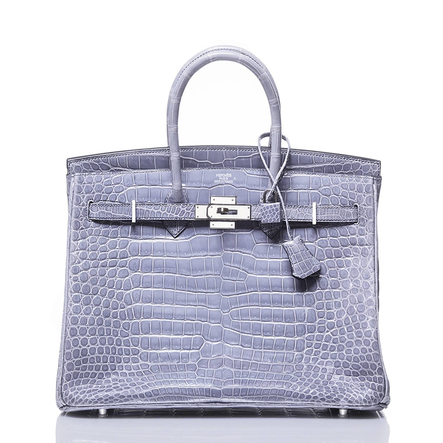 This exotic addition to the elevated range of Birkin bags from Hermès includes the classic 35cm size crafted in a soft, light blue crocodile leather, complimented by silver-tone hardware. This piece features a medium internal pocket along with