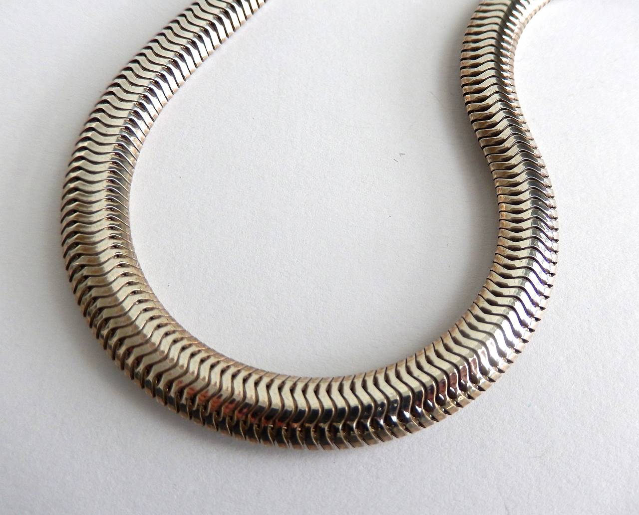 A beautifully constructed, vintage sterling silver snake chain probably from the 1930s.  Very comfortable fit.  Marked 