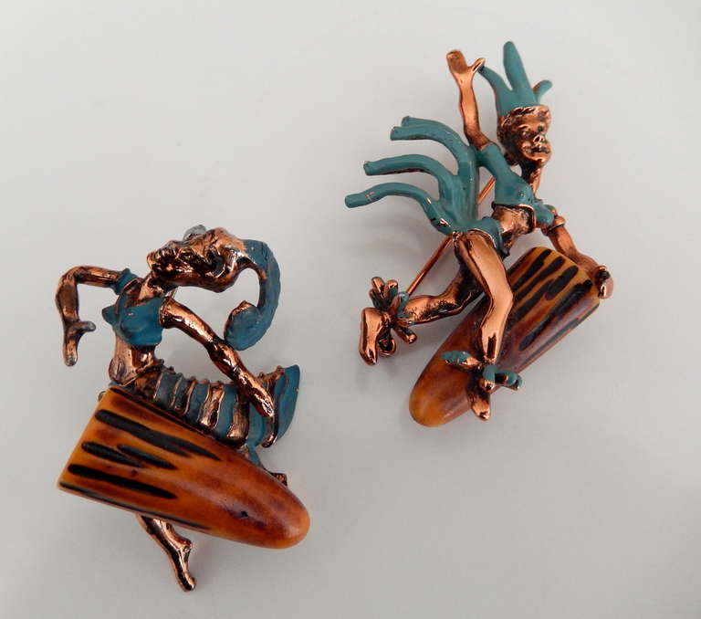 A lively, sculptural, enameled copper pin set from the Fifties of a pair of Carnival musicians. The motif of bongo drums, the quintessential beatnik instrument,  was very popular during the late 50s and early 60s. A similar set is illustrated in