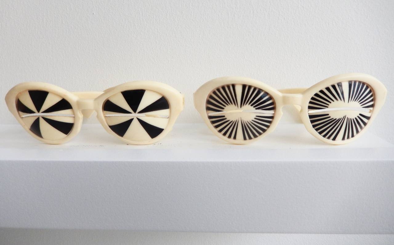 Two pairs of rare, vintage, black and white, "swinging sixties" sunglasses by SAMCO Italy with slot openings.  Their futuristic, boldly modern look epitomizes the 1960s.  Both in very good condition and impressed:  SAMCO MOD. DEP.  ITALY 