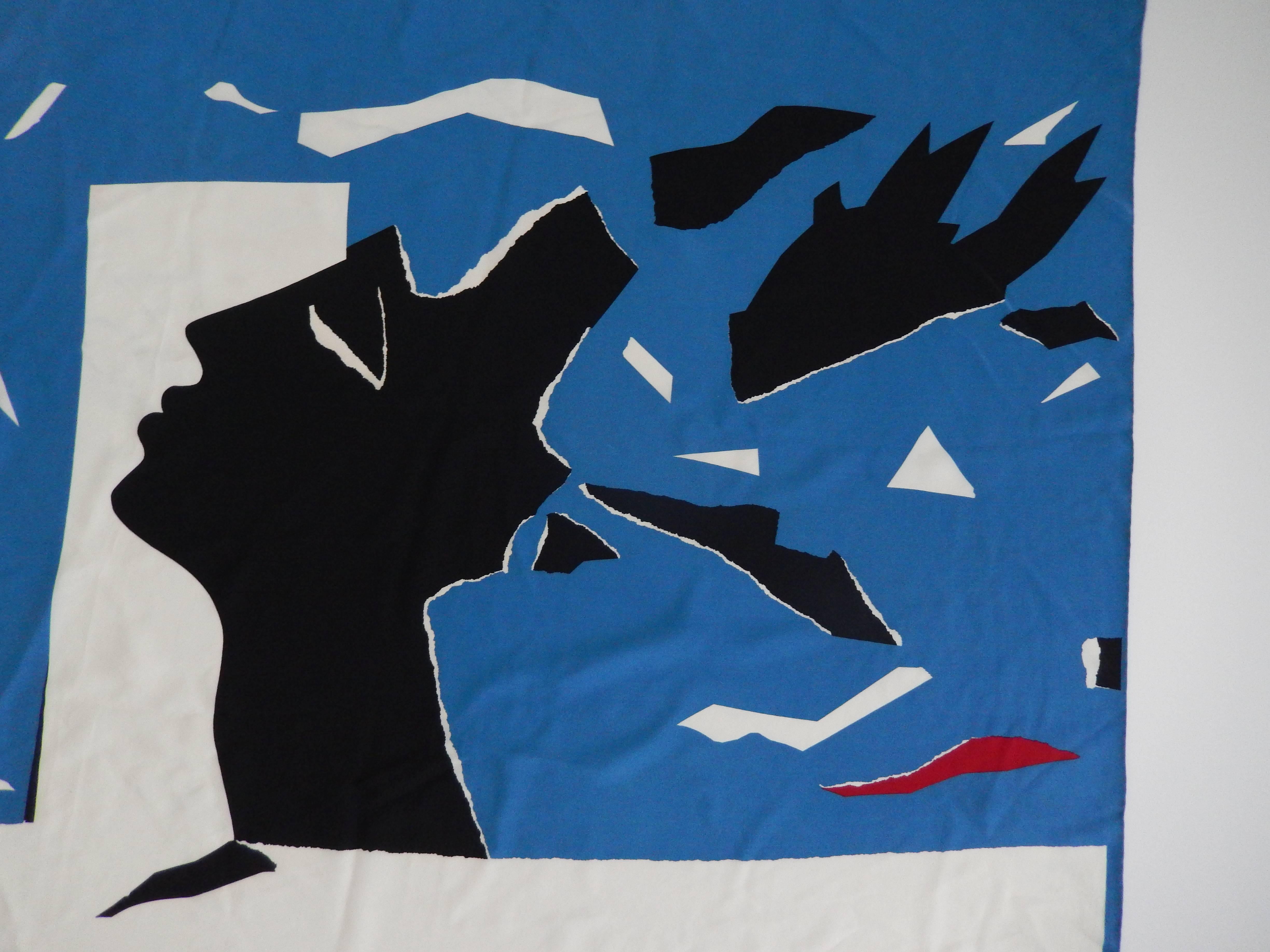 A chic red, white, and French Blue silk scarf by Yves Saint Laurent titled L'Hiver (Winter).  This scarf was created in conjunction with an exhibition on the designer at the Metropolitan Museum of Art in 1983.