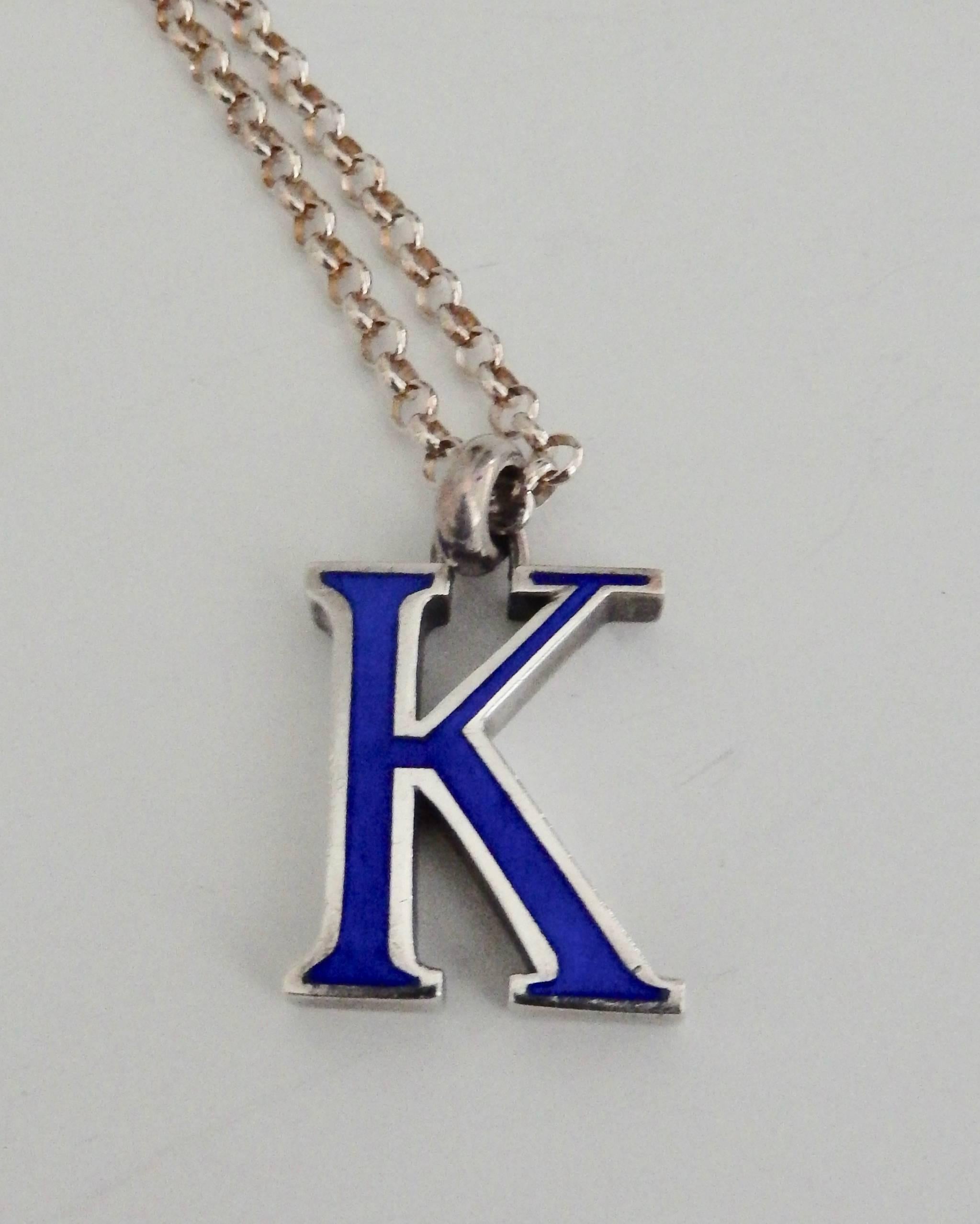 A very chic Seventies modern, blue enamel and sterling silver pendant from GUCCI with the initial 