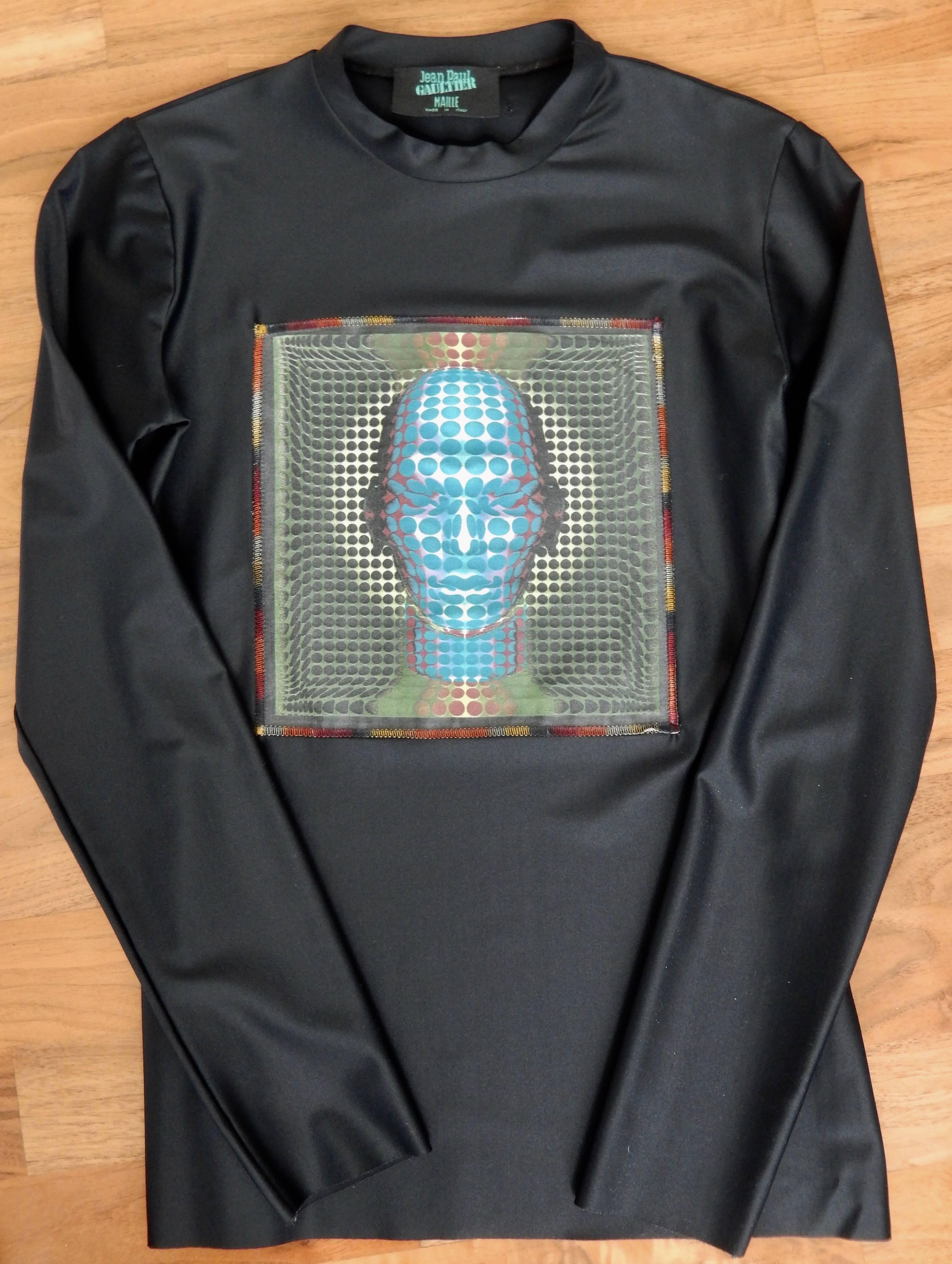 A nylon and spandex shirt by the avant-garde designer Jean Paul Gaultier.   Reminiscent of the artwork of Vasarely, the design for this collection was inspired by the 1979 Sci-Fi film Mad Max.  Though designed in 1995, Gaultier's futuristic 