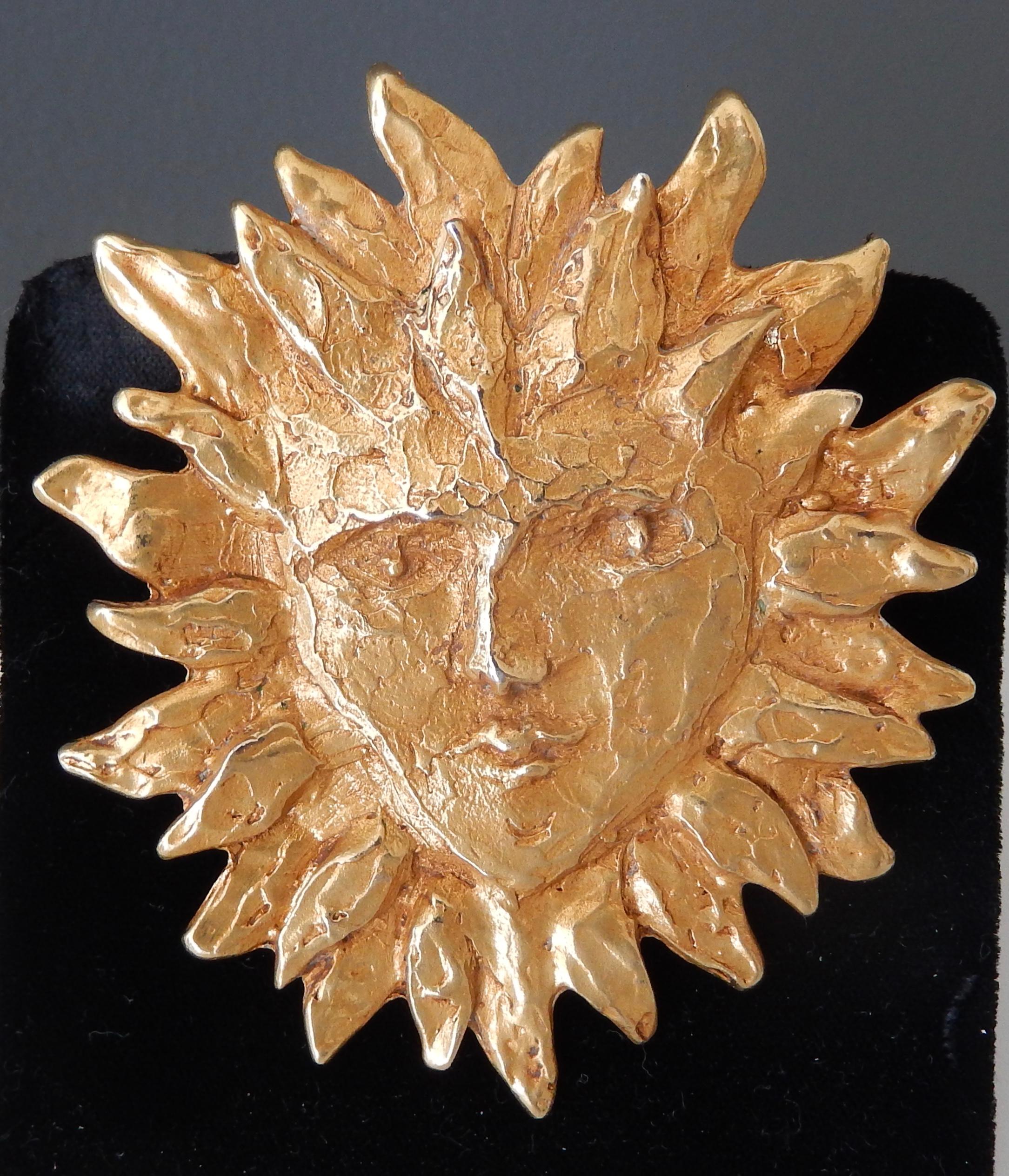 A large, highly sculptural Yves Saint Laurent brooch of a stylized sun (broche soleil), by the designer Robert Goossens.  The remarkable form is beautifully sculpted, evocative of the surrealistic images of Cocteau.
Marked:  YSL  Made in France A8