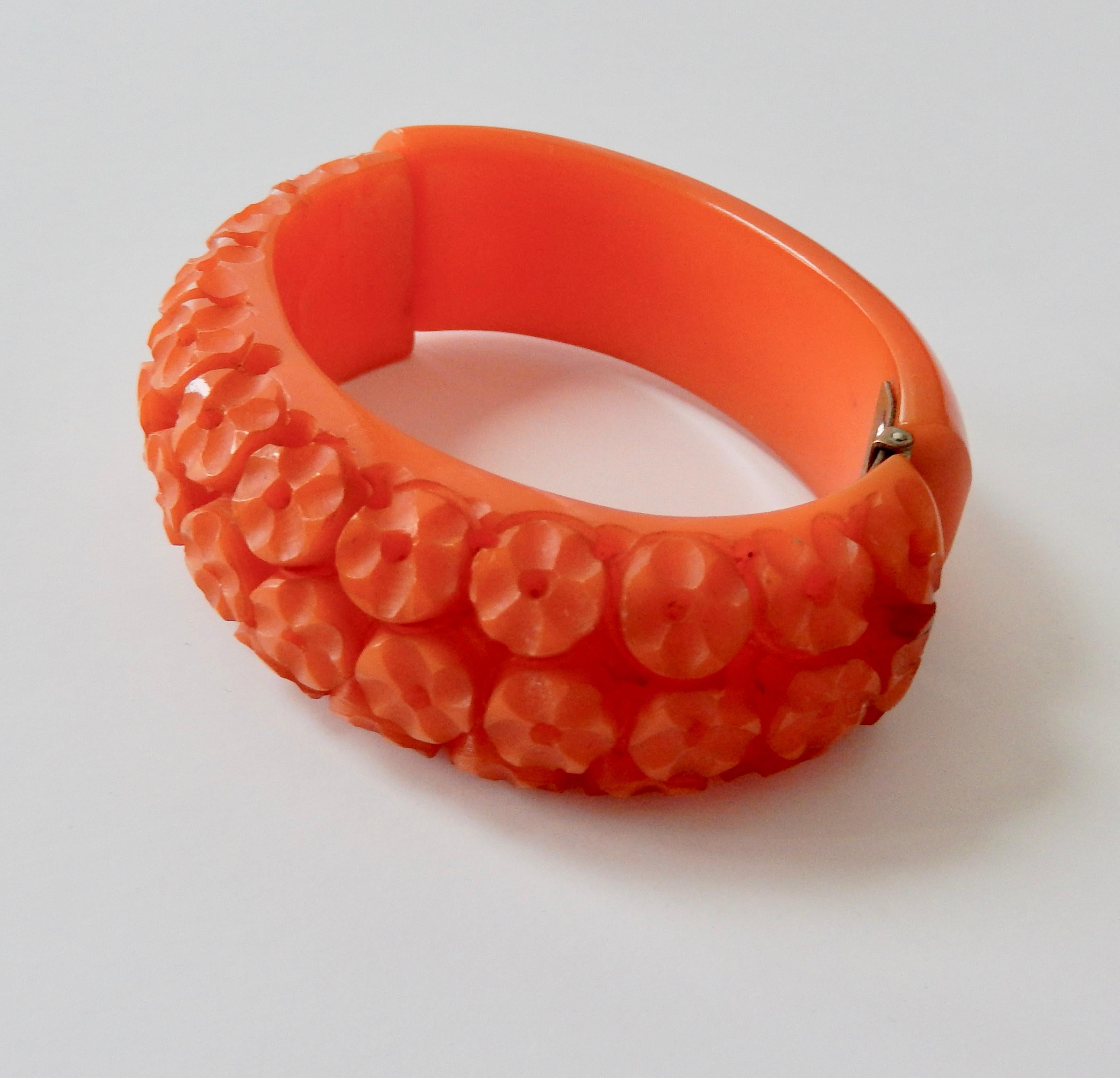 A beautifully carved, burnt orange, vintage bakelite bracelet (the color resembles 