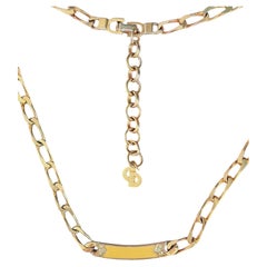 Collana Christian Dior vintage in oro con cristalli gialli ricurvi e motivo Omega intrecciato