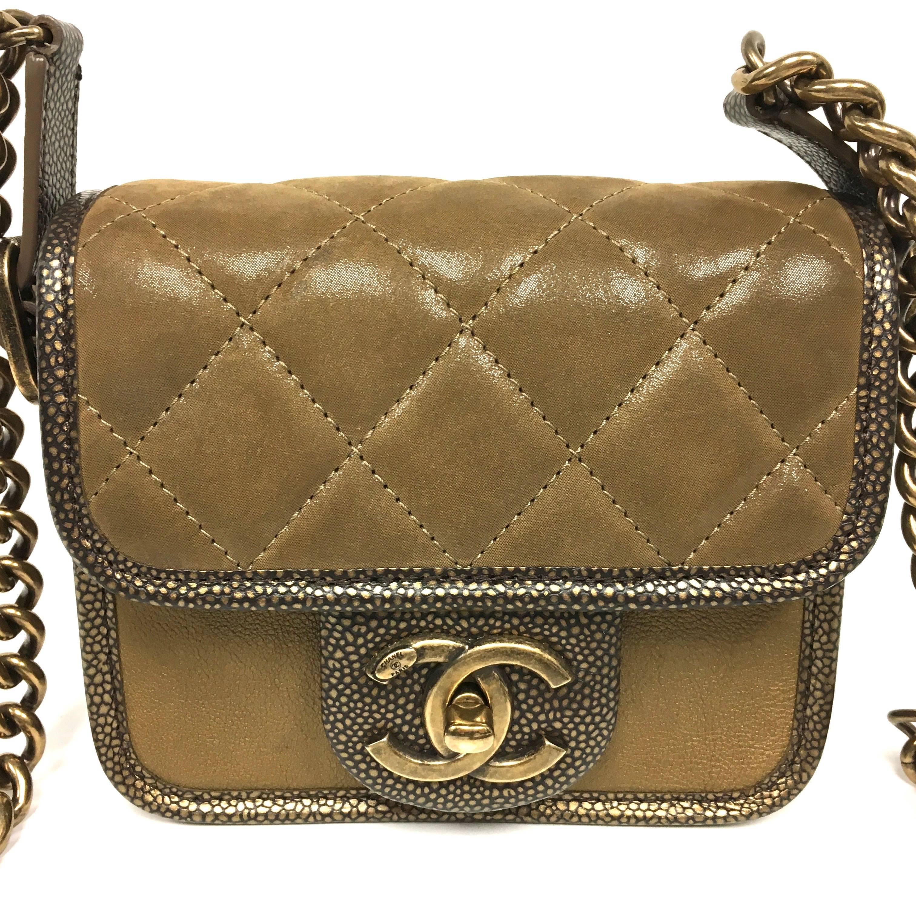 Authentic CHANEL Iridescent Calfskin Back To School Mini Crossbody Flap in Brown and Bronze from the 2012 Fall collection.. "A cross between a boy and a classic mini square flap." Crafted of textured diamond quilted calfskin leather with