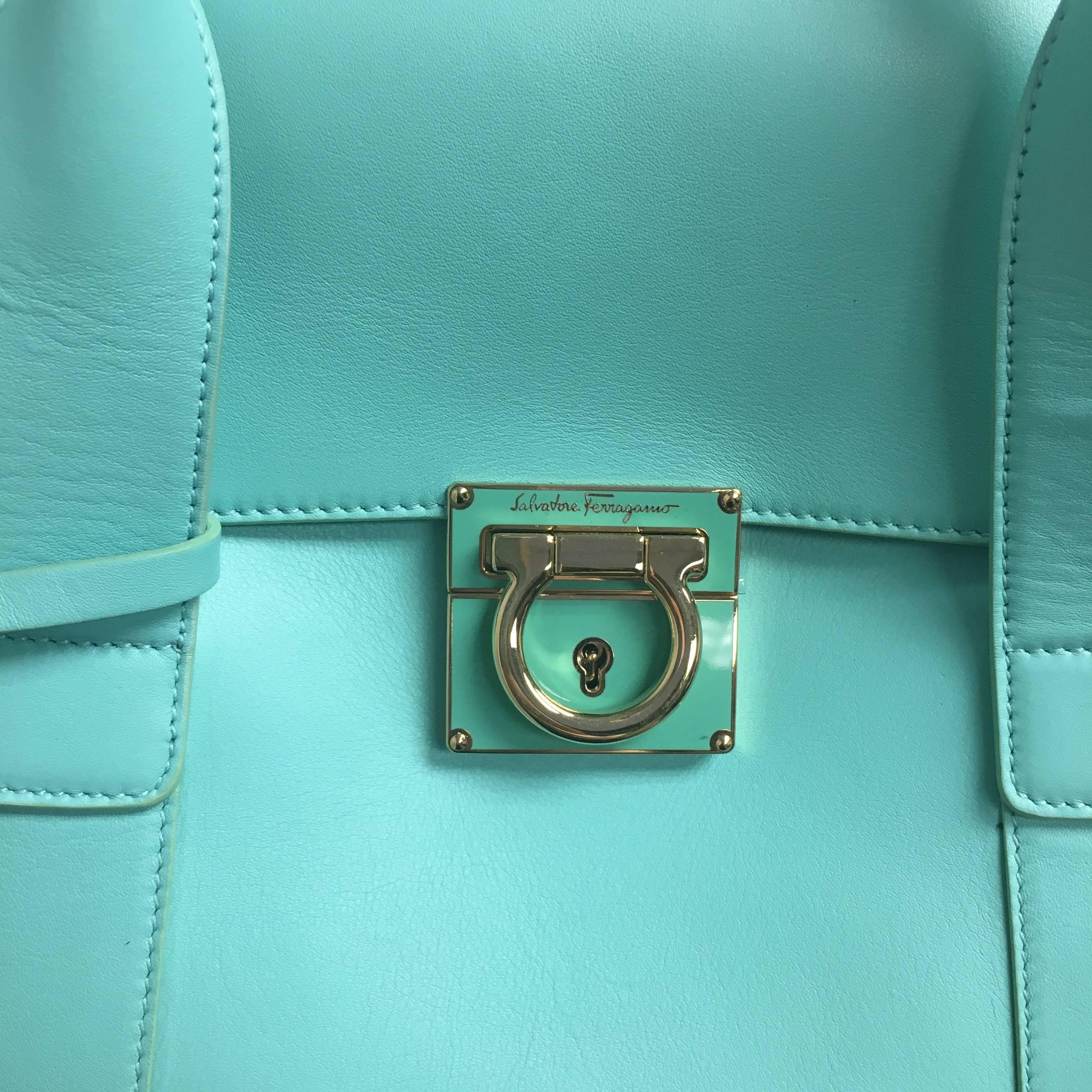 Detailed in pretty pastel turquoise, Salvatore Ferragamo's smooth leather tote is an excellent summer bag choice. Flap with logo hinged lock closure, double top handles with key fob attached. Inside, removable leashed zip pouch.
Leather lining.