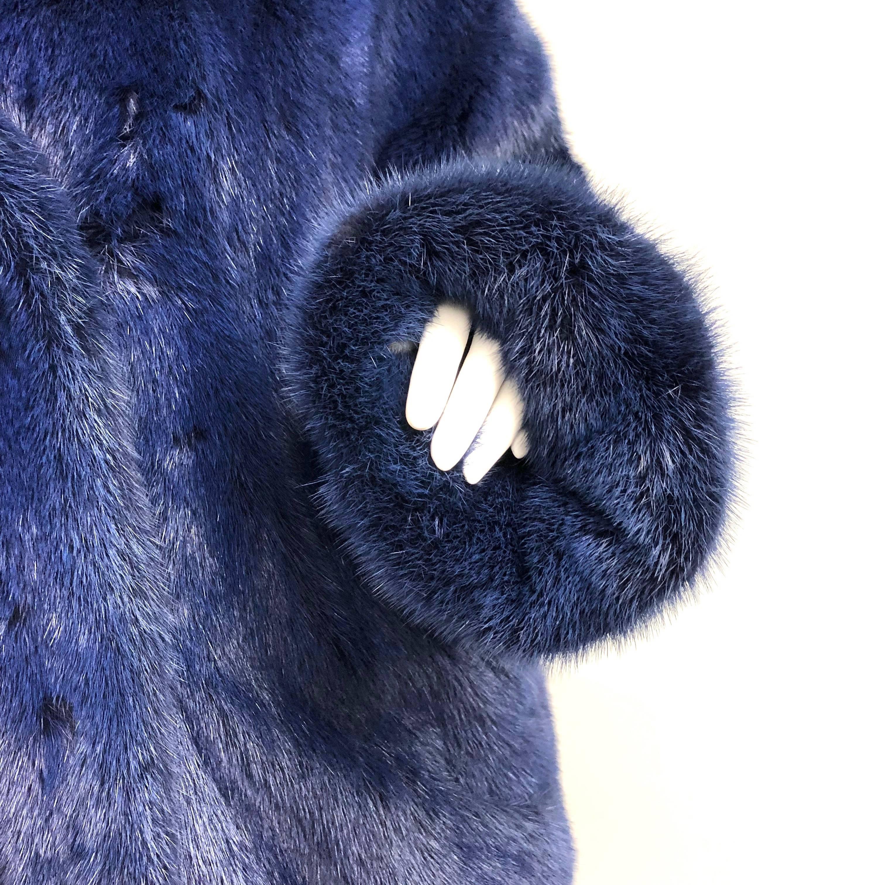 Beautiful blue mink fur jacket with raglan sleeves. Easy to wear with two fold over hook closures on the front,  nice collar, two slasp side pockets. Slouchy oversized look. Monogrammed inside. 
Size: Medium (6-8) Please not that size is not marked.