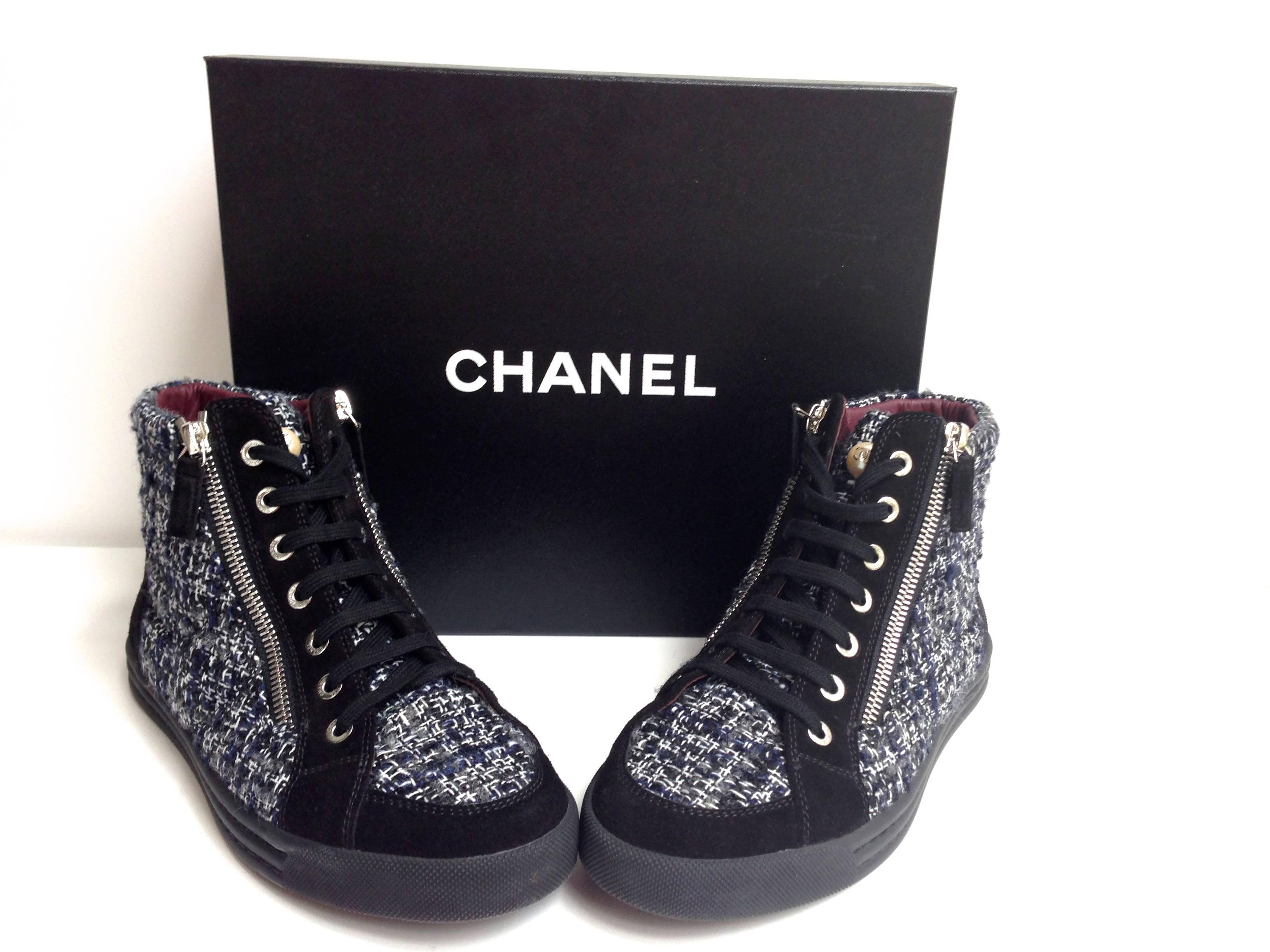 Chanel Black Blue White Tweed Twill CC Logo Pearl High Top Sneakers 
Retail: $975,-  Sold Out.  2014 Fall Collection. 
Condition: Like NEW, worn once.
Size 38.5 / 8 US (please refer to measurements below)
Double zipper - (leather gusset)
Black,