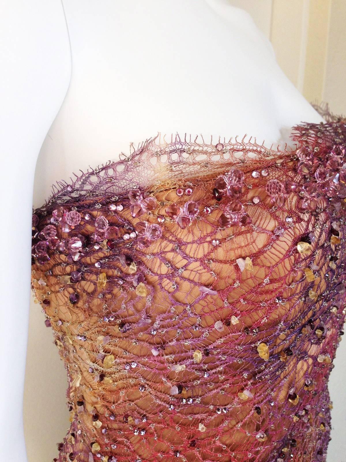 Custom Made BARACCI HAUTE COUTURE of Beverly Hills Lace Swarovski and Natural Crystals Beaded Dress. SIZE S. Retail: $5,500 

The stunningly embellished strapless French lace gown featuring hand-sewn Swarovski crystals and Natural Amethyst,