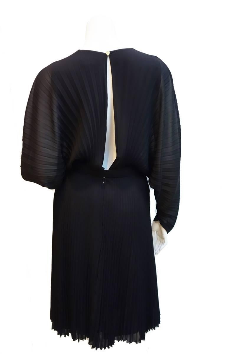 Gianni Versace Couture Black Pleated, Batwing Chiffon Vintage Dress with Greek Key Belt and a Built in Bodysuit Bottom.  Amazing, hard to find piece of the Greek Key Collection. Original size/composition label have been removed. Approximate size: 4