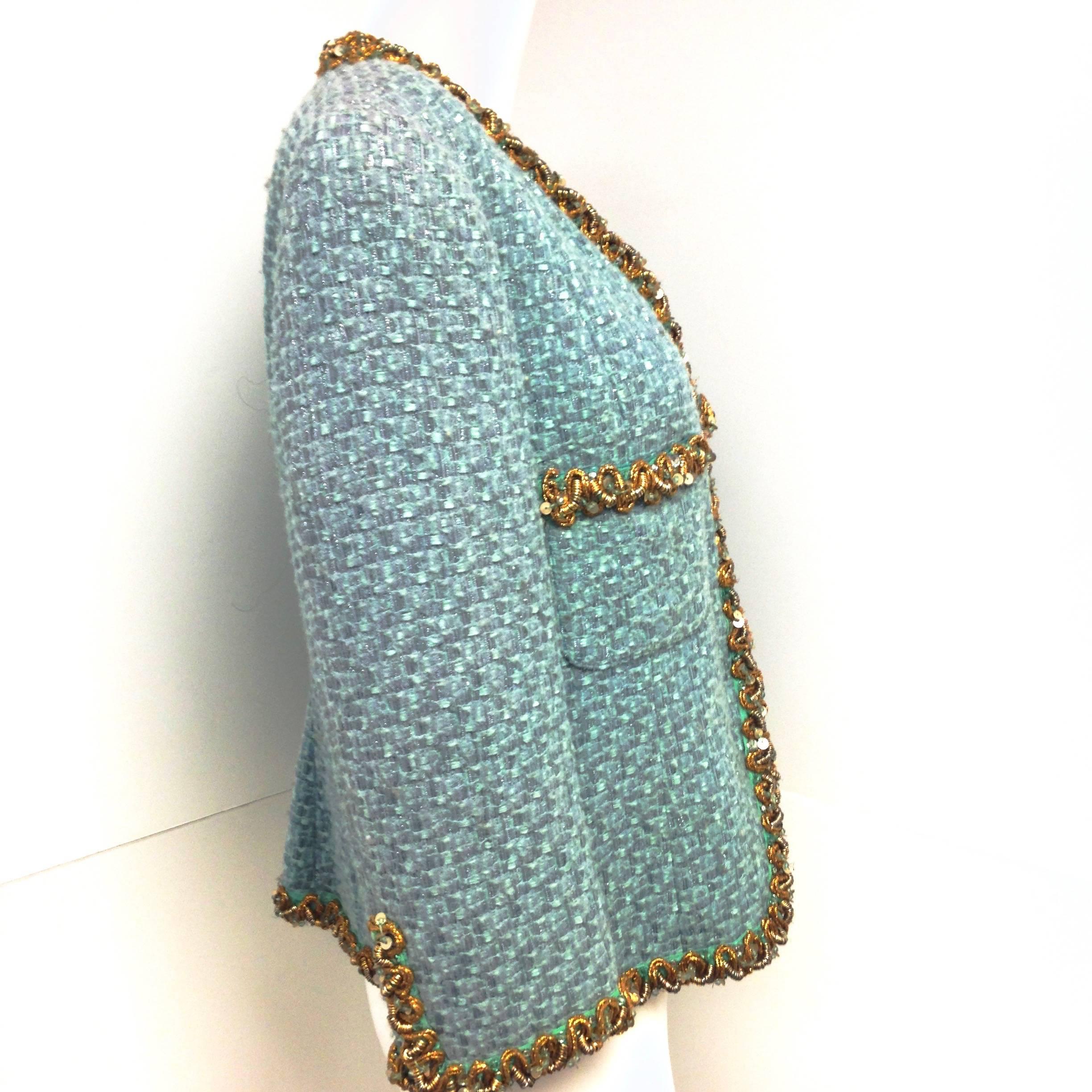 Blumarine Aqua color tweed jacket with gold embellished trim and large snap closure. Fully lined with matching color logo lining. 
Excellent Preowned Condition.
Dress it up or down, it looks great with denim and pump.
Size: 44 ITA, 38