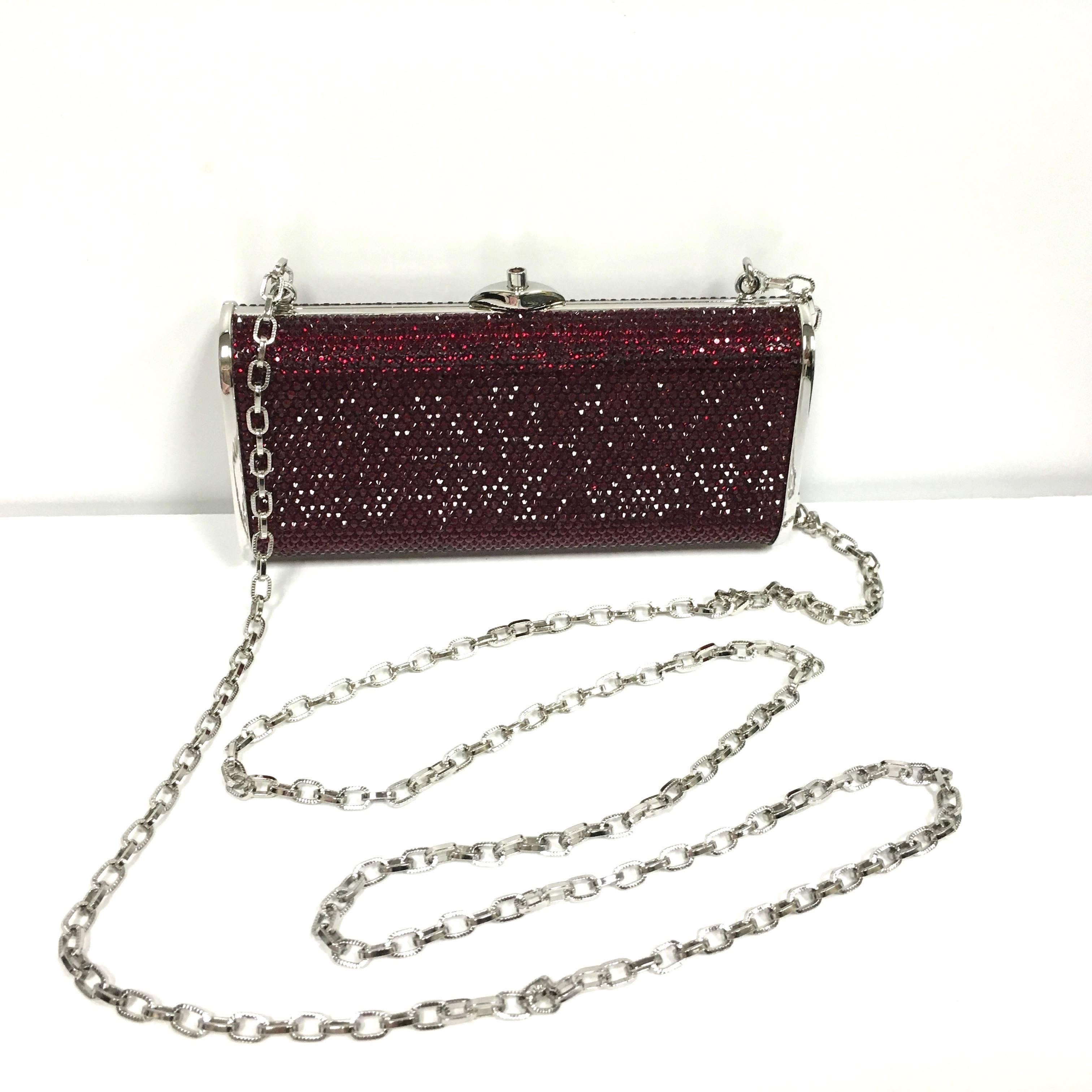 JUDITH LEIBER Silver Framed Red Crystal Minaudiere Clutch Bag
New with Tag Retail: $ 1,395.00
 
Exhibit flawless hand-craftsmanship with this authentic Judith Leiber red crystal studded evening clutch by your side. In this captivating piece,