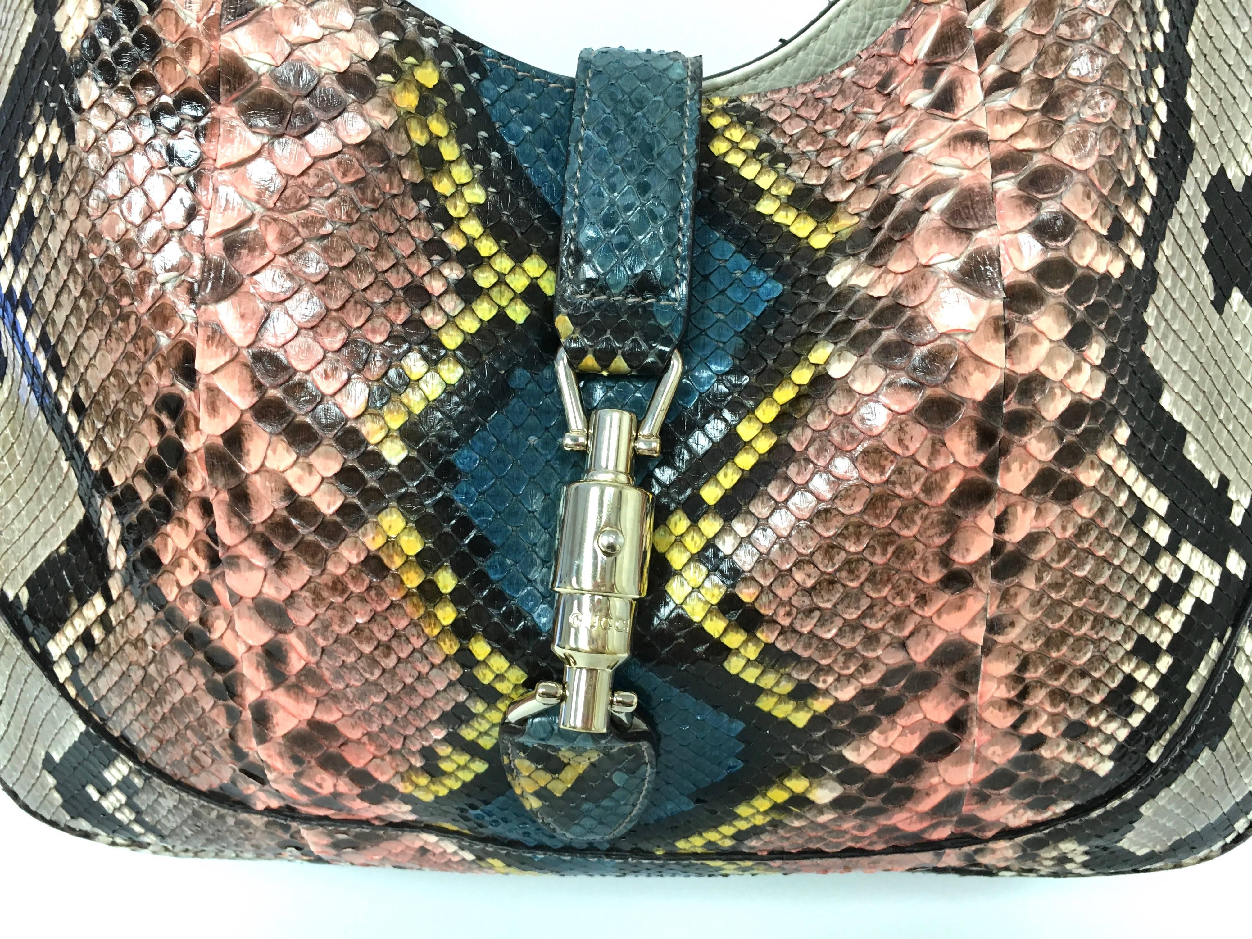 Authentic Gucci Jackie Python Las Vegas Bag
Retail was: $3,800.00 Sold Out!
Python skin defines this roomy carryall.
Adjustable and detachable shoulder strap, 8¾-19¾
