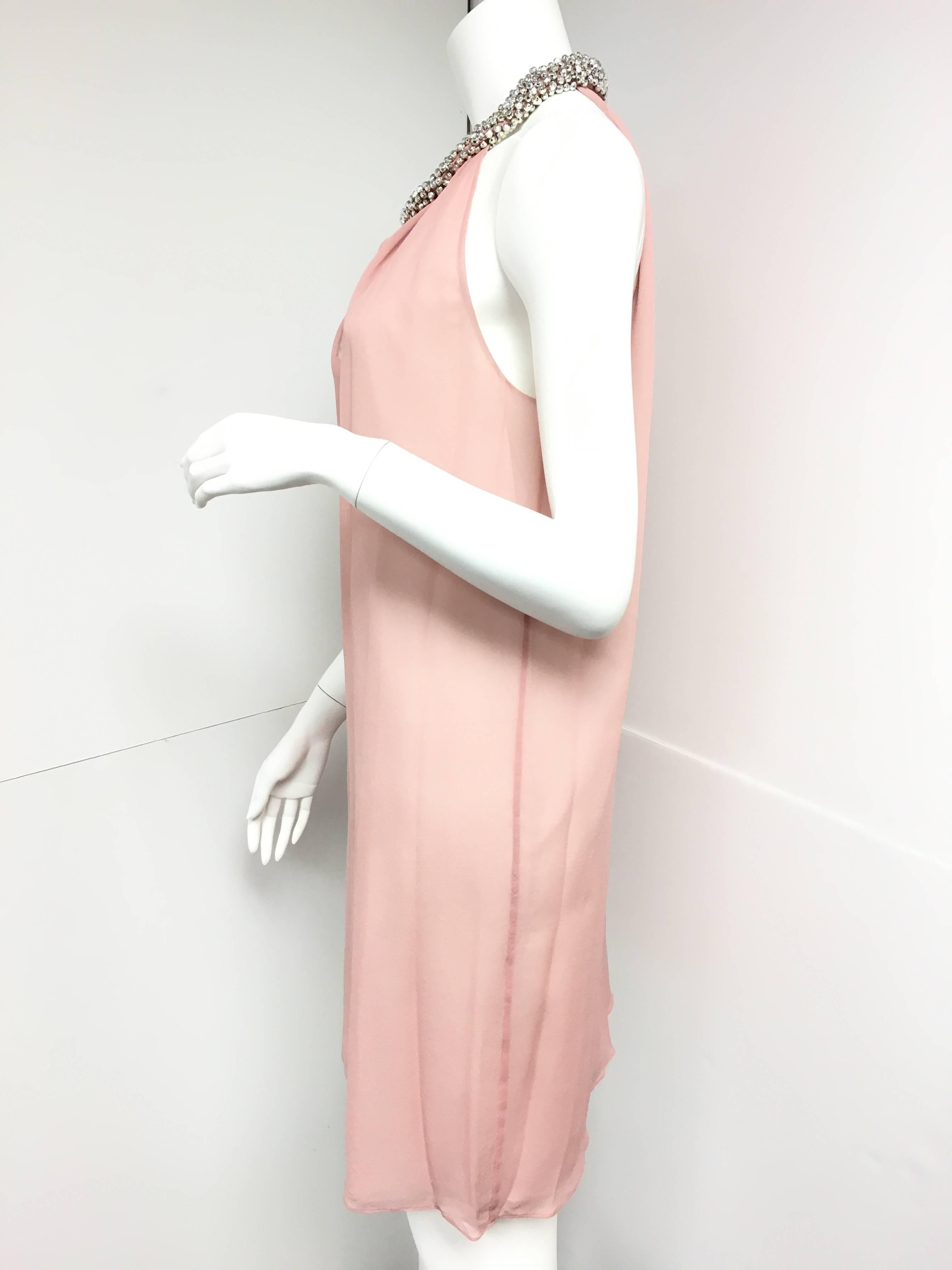 Complete the tale of a modern day princess in the Diane von Furstenberg Lainey dress by applying soft makeup and crystal-embellished pumps.
Beaded halter neckline; keyhole back.
Approx. 33"L from shoulder to hem.
Shift