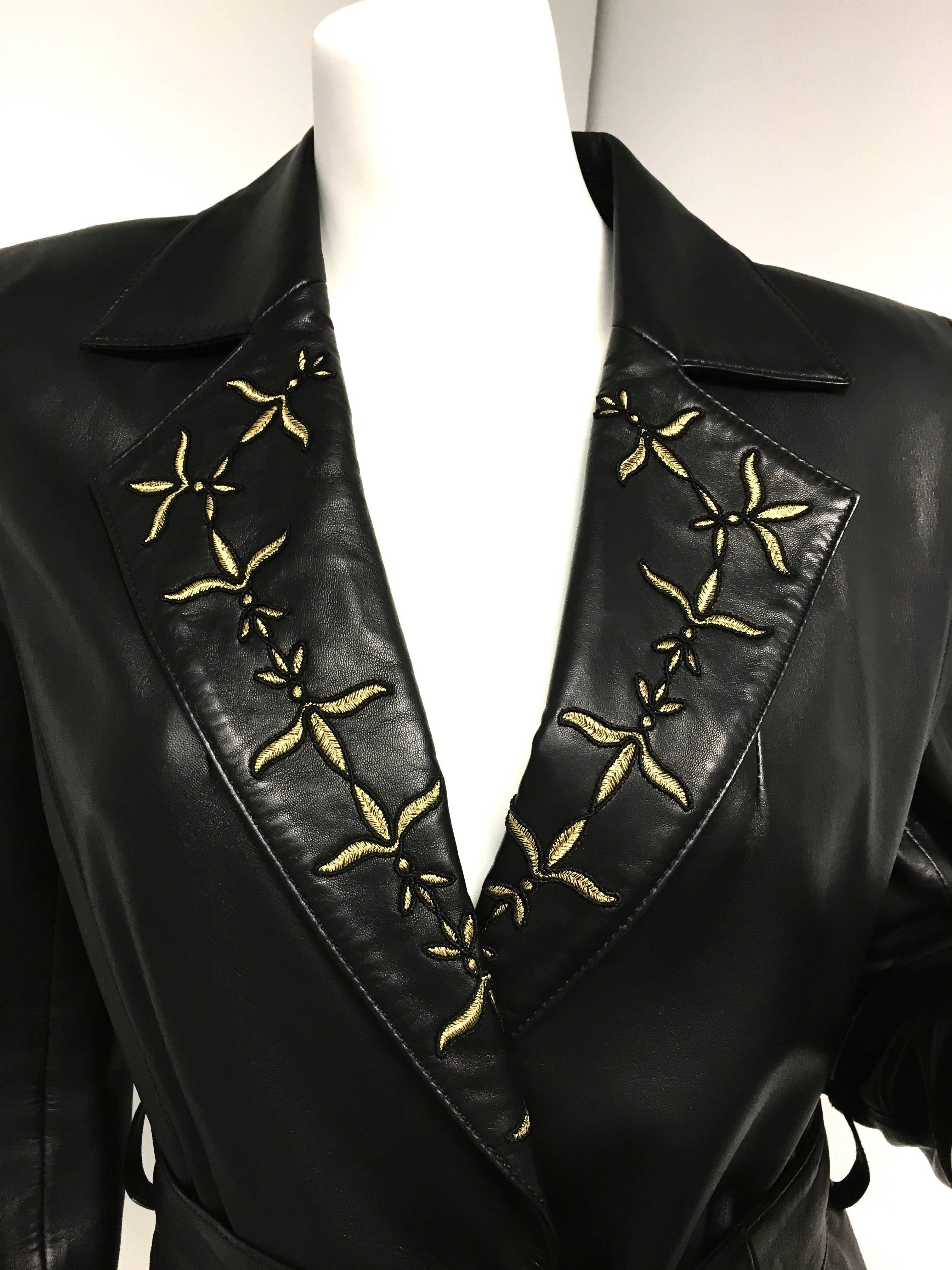 Gorgeous Escada black belted leather jacket / coat with gold and black embroidered collars and sleeves. Fully lined with Escada logo lining. Single gold button front closure. 
Condition: New without tag. 
Size: 36 (Small)
Made in