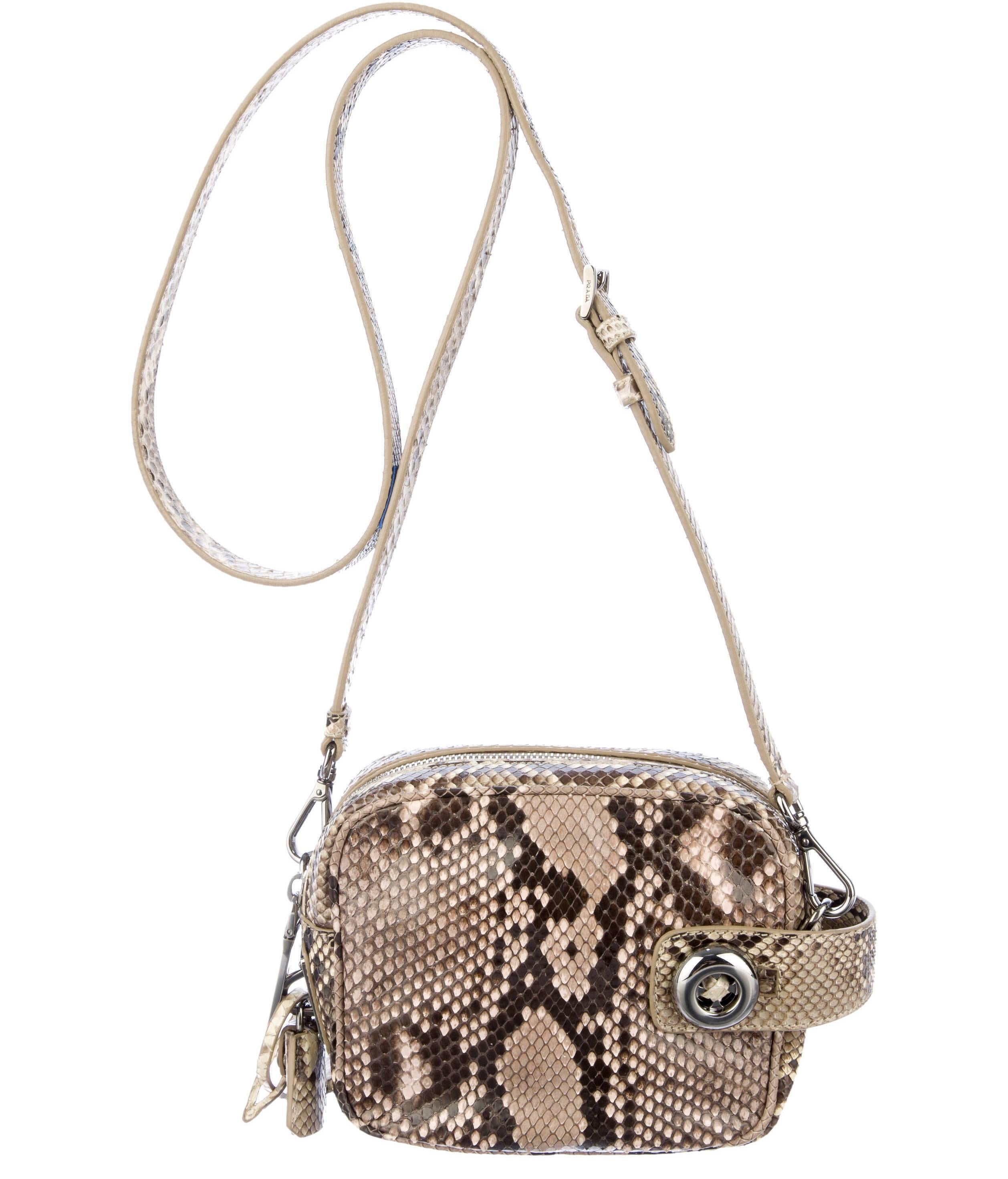 Gorgeous Prada python cross body bag in brown tones, with silver color hardware, removable and adjustable shoulder strap, leather lining, interior side pockets and top zip closure. Original dust bag included.
From the 2011 Runway Collection.