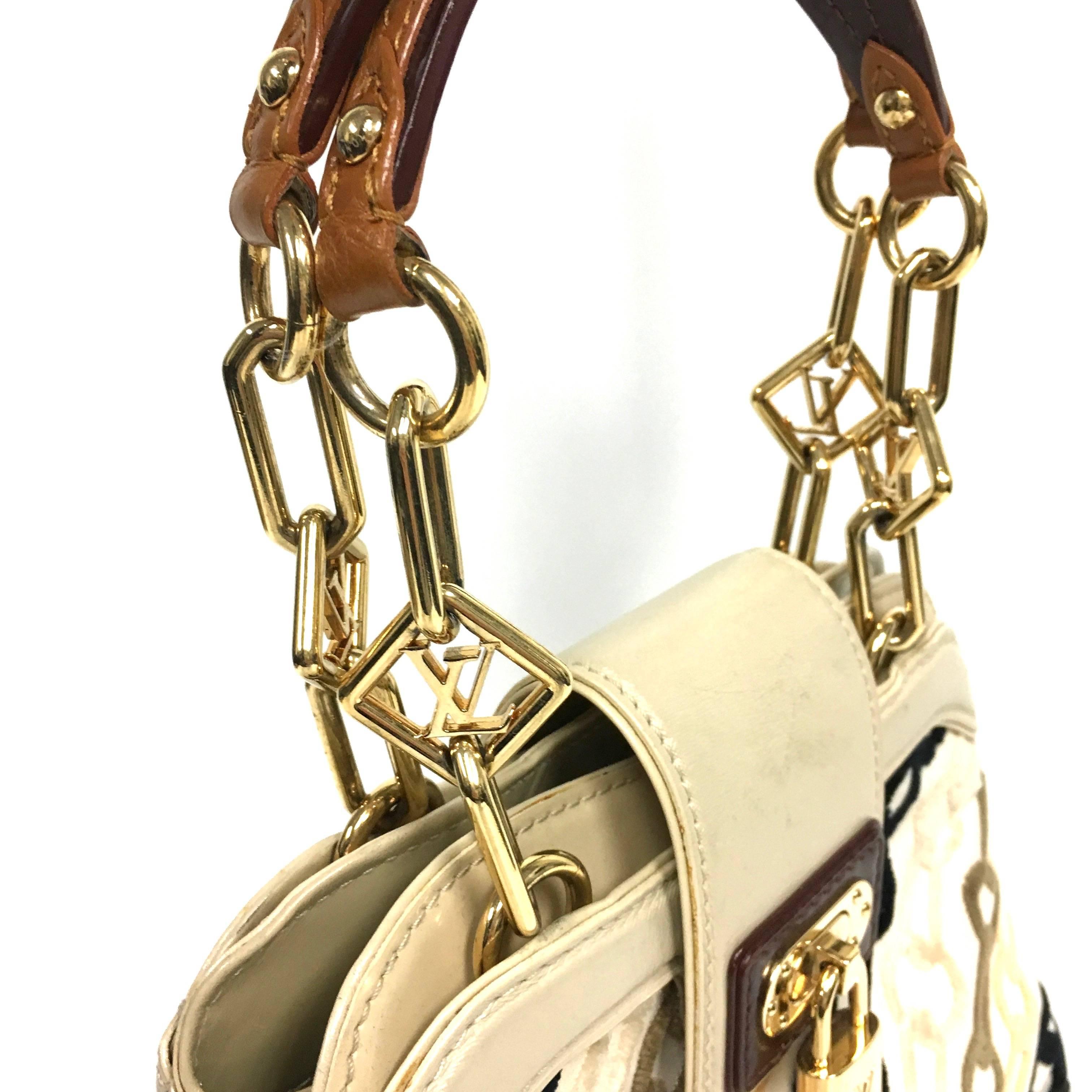 Designed by Marc Jacobs for the spring/summer 2006 collection, this line was inspired by the 1960's and features white silk canvas with jacquard velvet chain design, black-sand-and brown leather trim, and a two leather handles that have golden LV