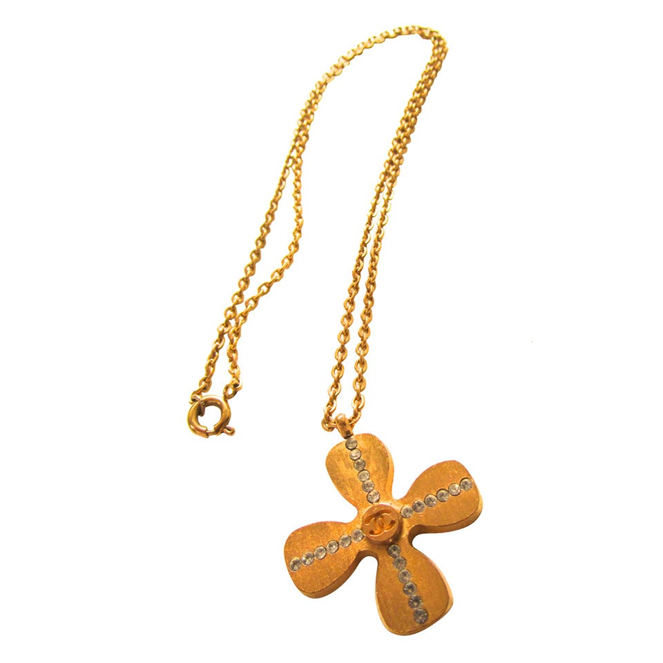 Chanel Gold Tone Necklace - Clover Shaped Charm with Crystal Cross Inlay For Sale