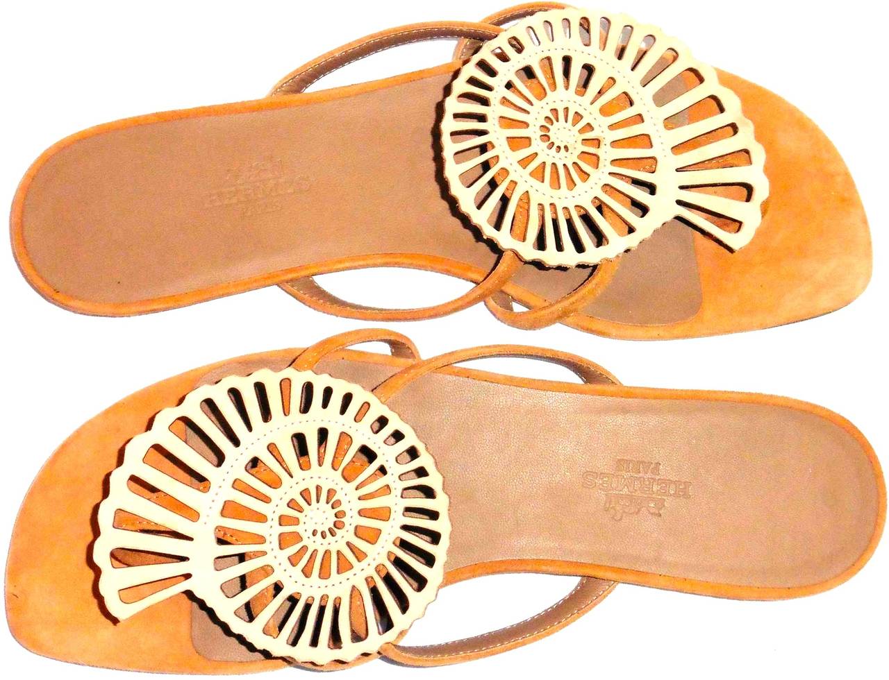 New Hermes Nautilus sea shell leather sandals. Very difficult to find this particular pattern. Sold out in most storefronts. Gorgeous soft beige tan leather. Flip flop style. Beautiful sandals that can be worn in a variety of occasions. 

More